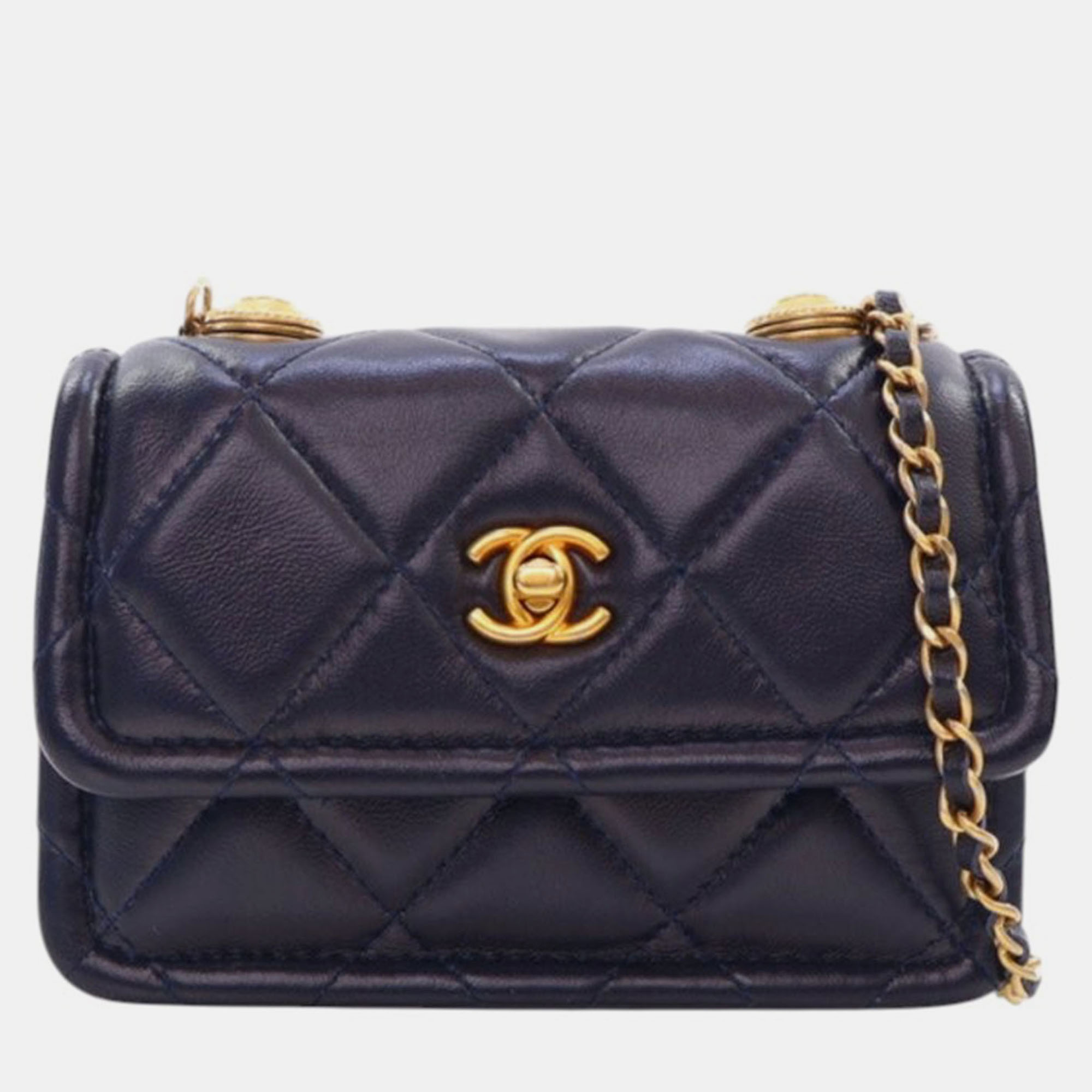 Click to view more detailed imagery on our partner's website Pre-owned Chanel Navy Blue Mini Quilted Shiny Lambskin Button On Top Flap