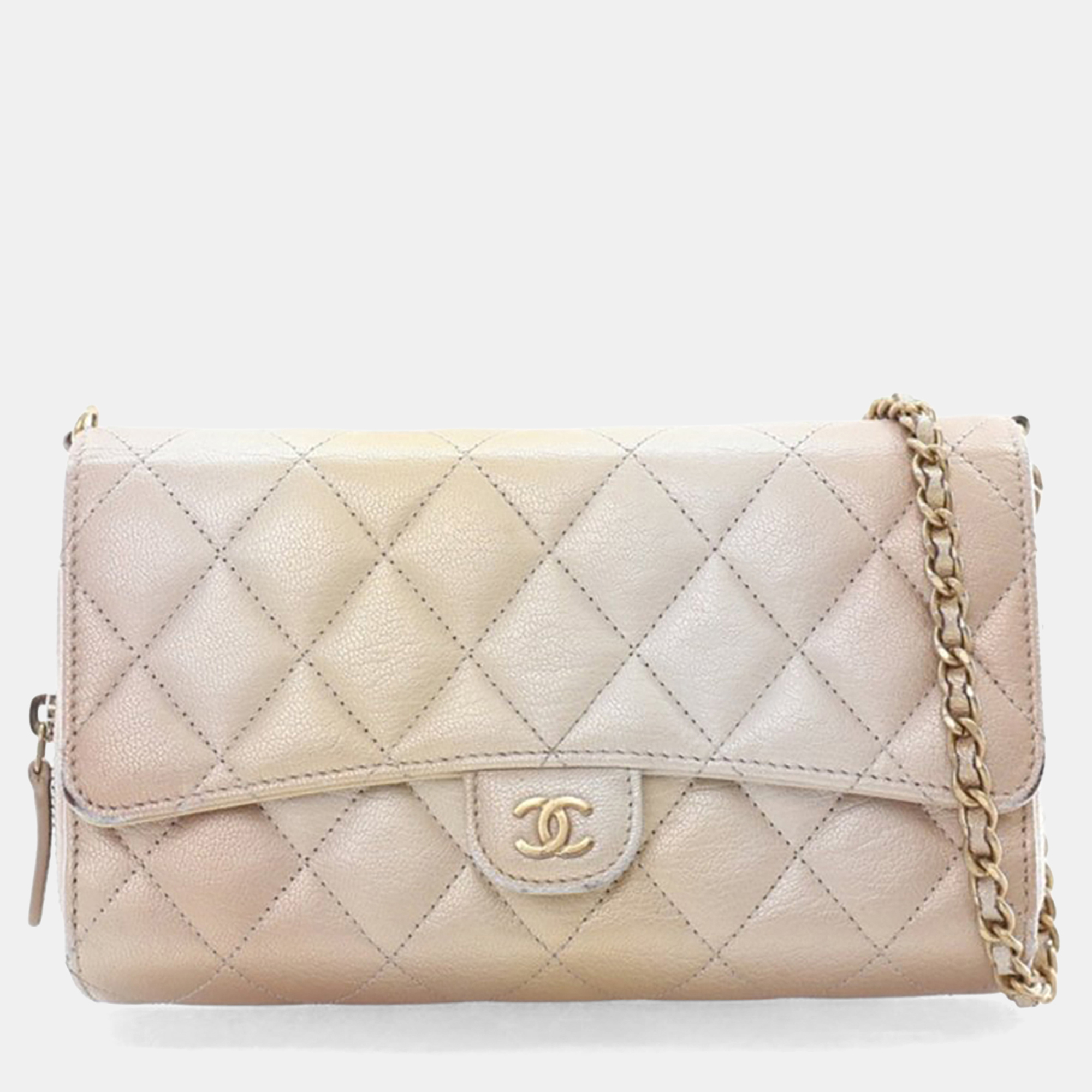 Click to view more detailed imagery on our partner's website Pre-owned Chanel Metallic Lambskin Phone Holder Wallet On Chain (woc) In Gold