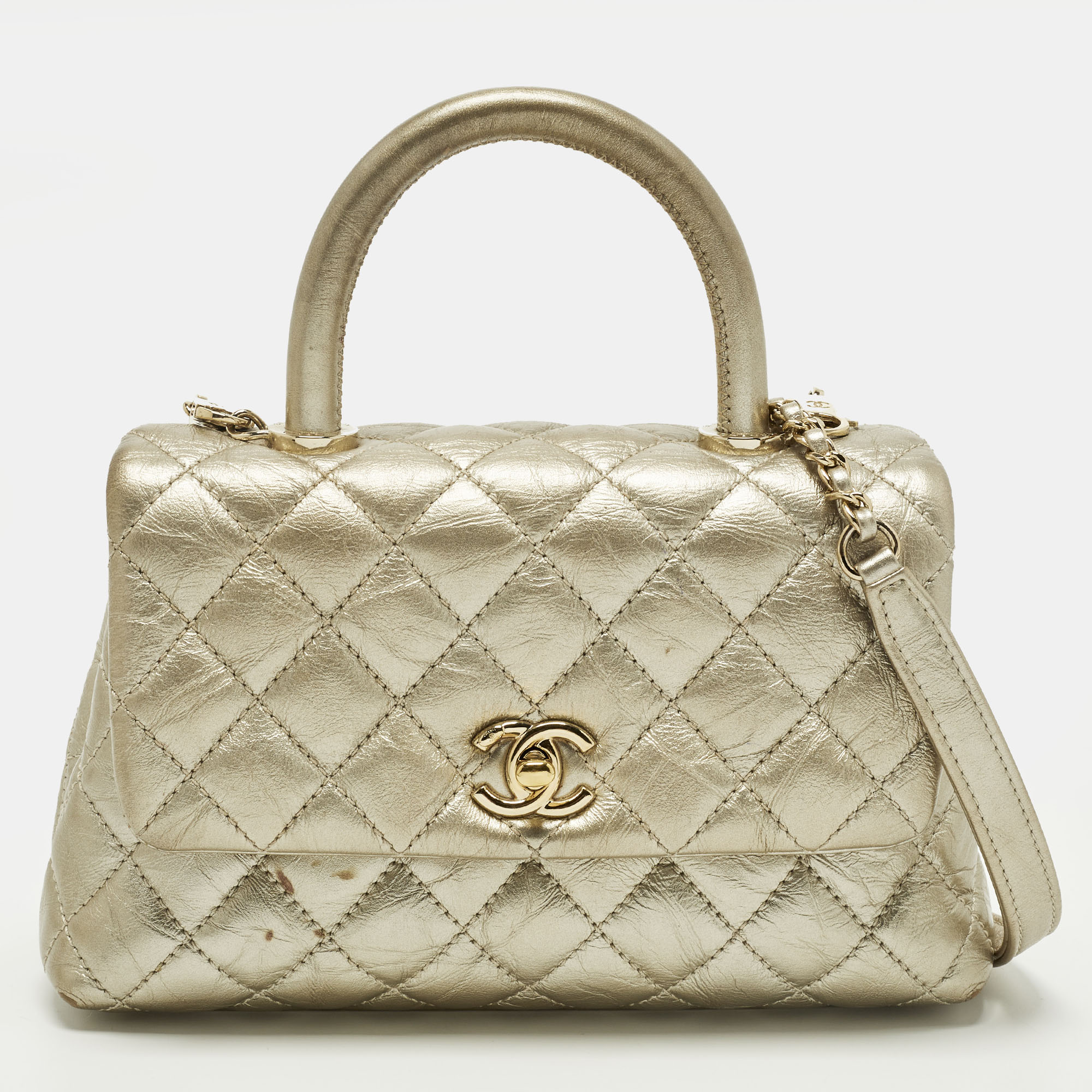 

Chanel Coco Handle Mini Gold Quilted Aged Leather Top Handle Bag