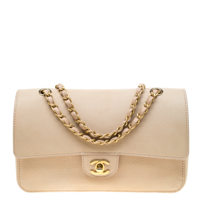 chanel bag with gold bar on top