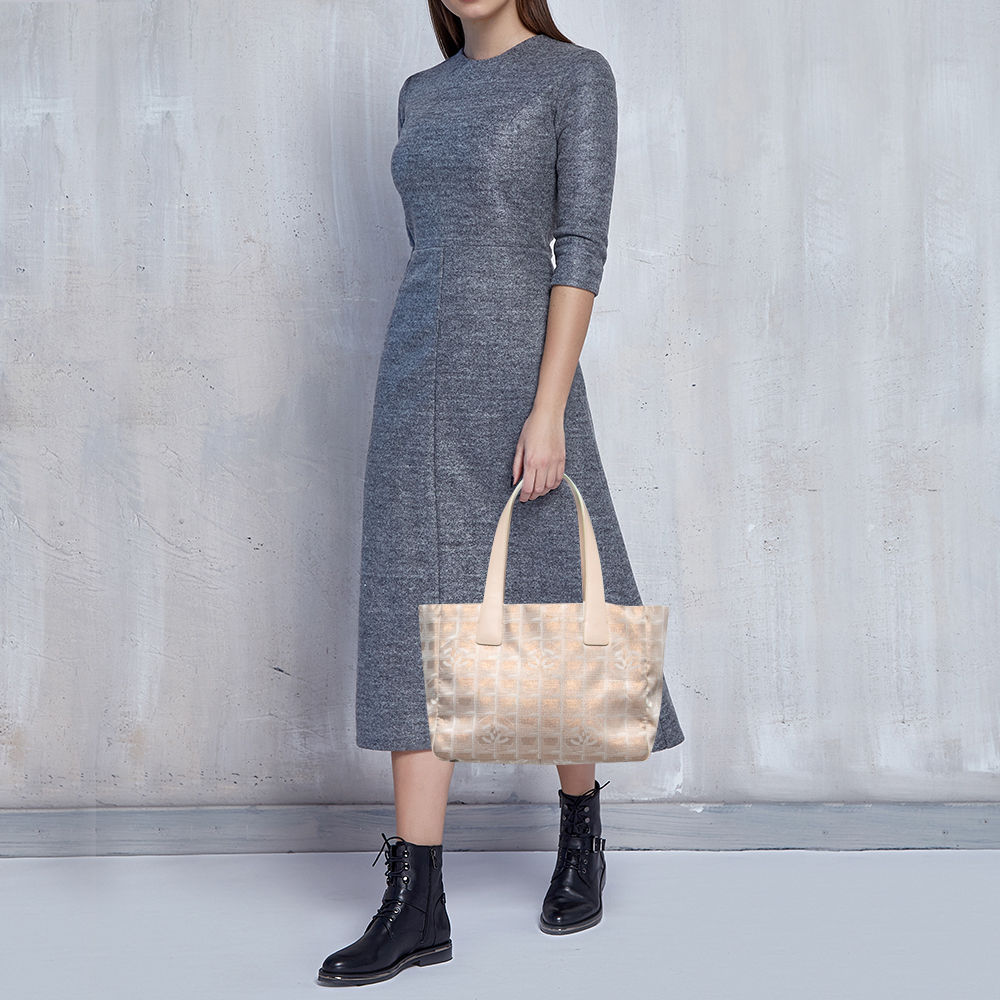 

Chanel Beige/Rose Gold Nylon and Leather Travel Line Tote