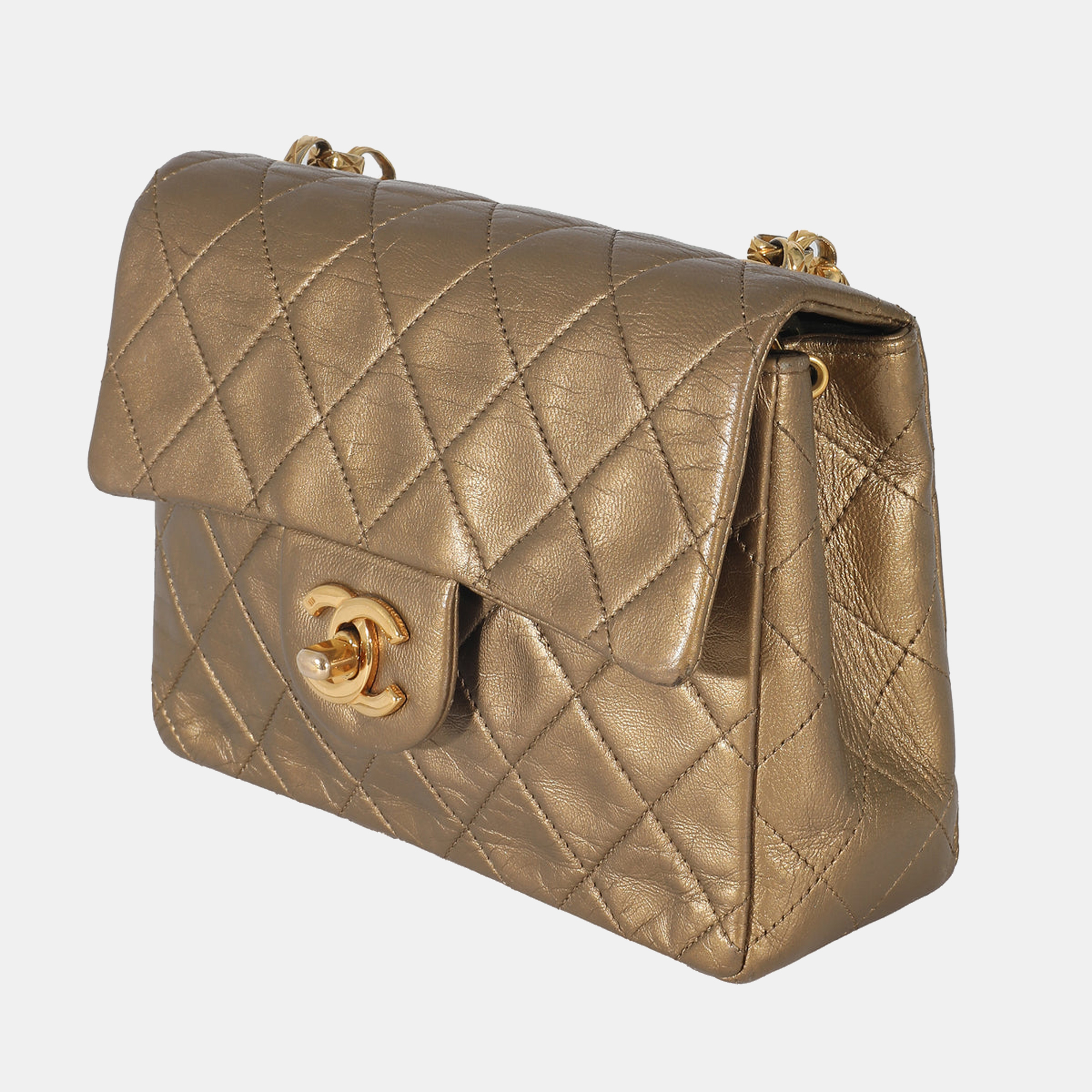 

Chanel Vintage Quilted Metallic Gold Leather Chain Mini Flap Bag