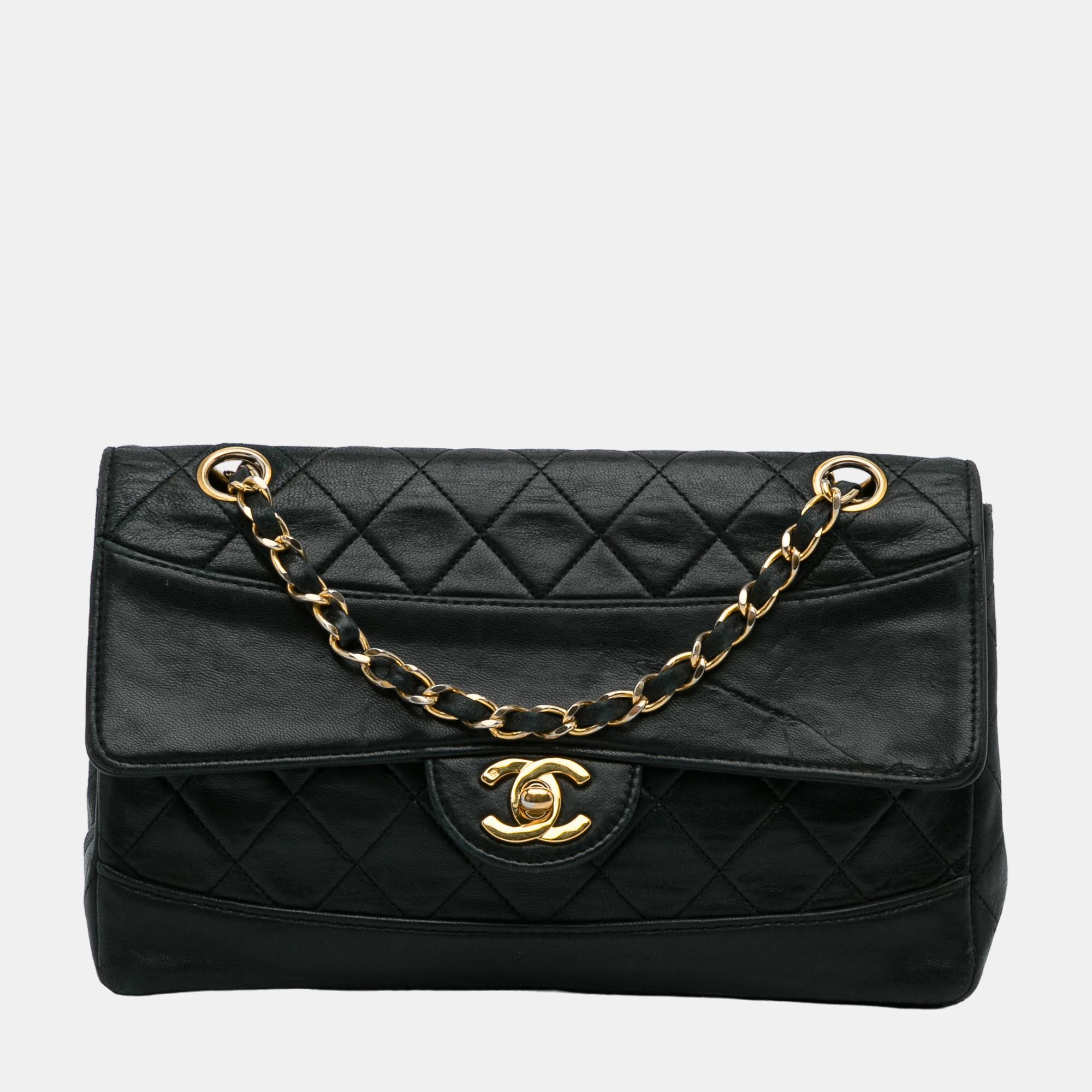 This shoulder bag features a quilted lambskin leather body a woven leather chain strap a front flap with twist lock closure and an interior slip pocket.