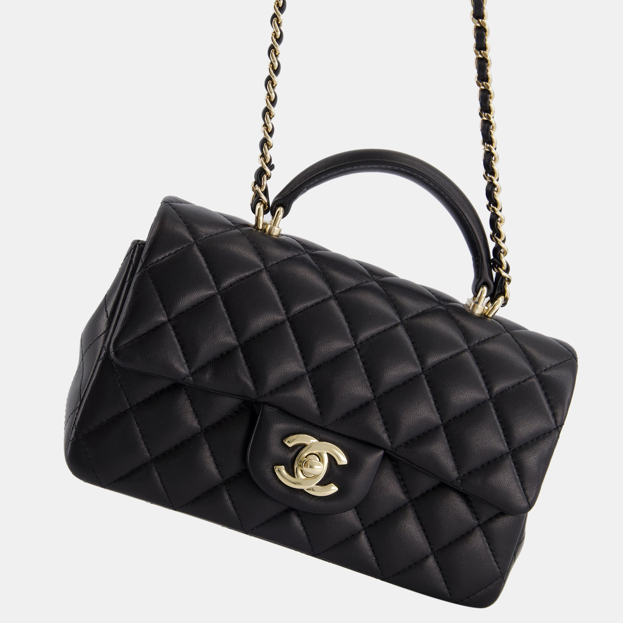 

Chanel Black Mini Rectangular Top Handle Flap Bag in Lambskin with Champagne Gold Hardware