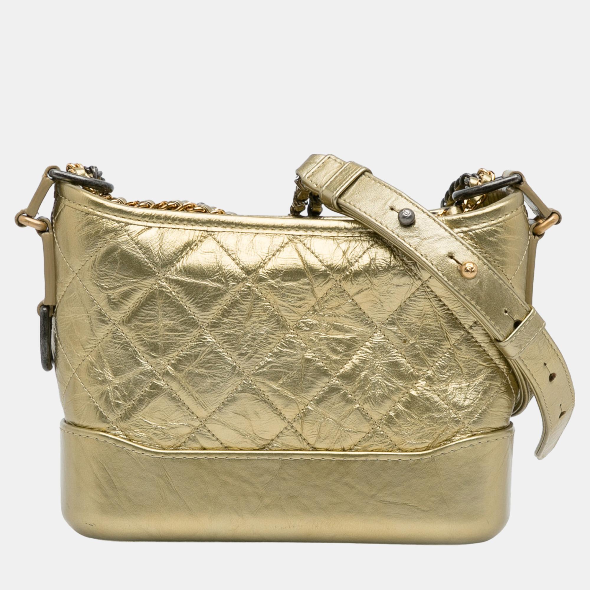 The Gabrielle features a quilted leather body detachable chain link leather shoulder straps a top zip closure and interior zip and slip pockets.