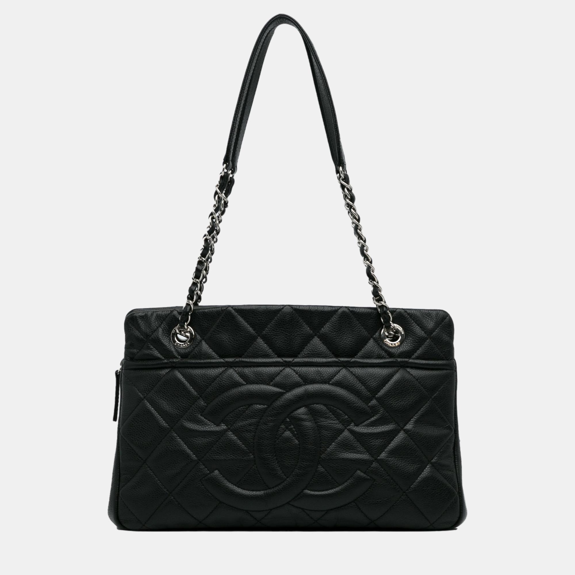This tote bag features a quilted leather body leather woven chain straps with leather guard an open top with magnetic snap closure exterior slip pockets and interior zip and slip pockets.