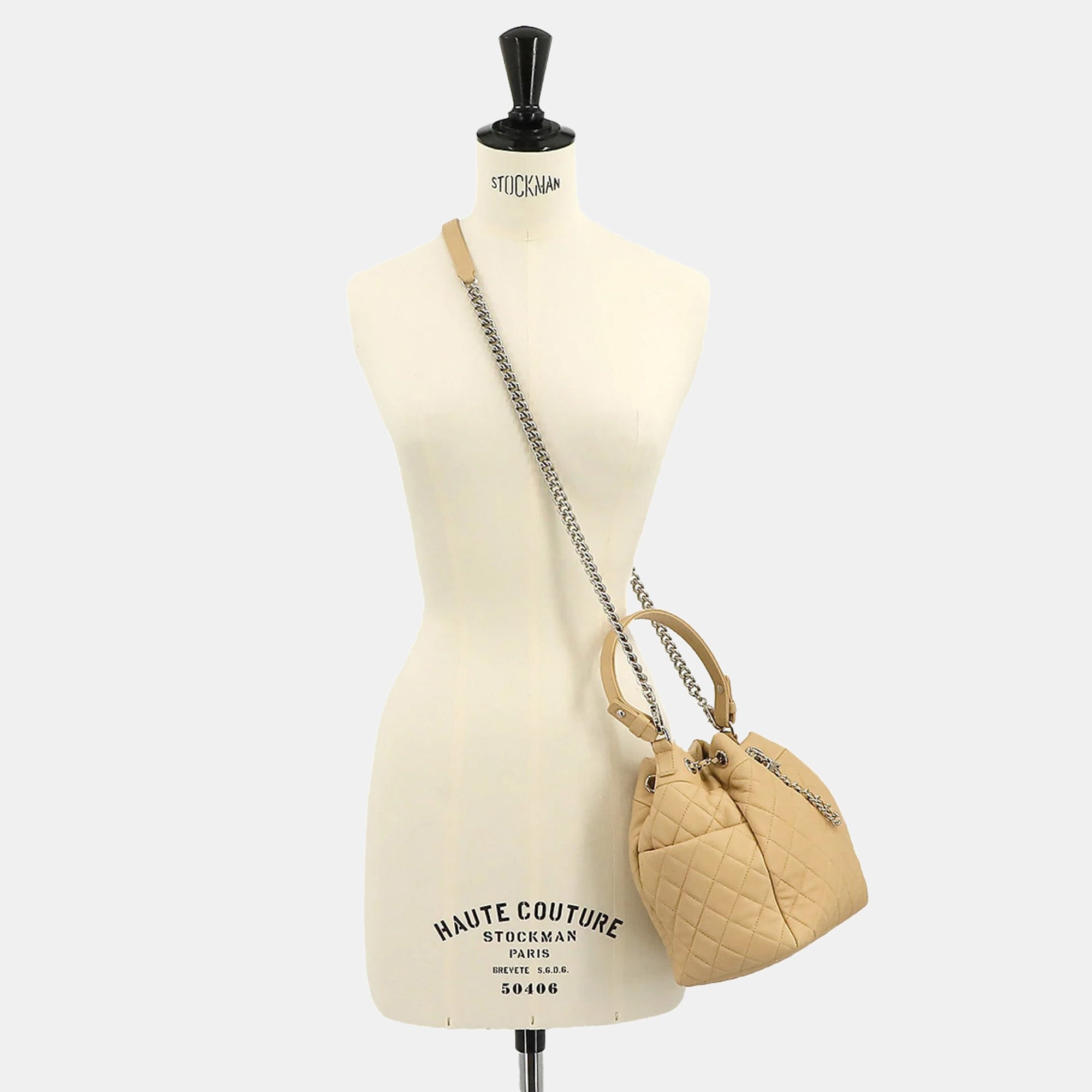 

CHANEL Beige Quilted Lambskin Small CC Chain Drawstring Bucket Bag