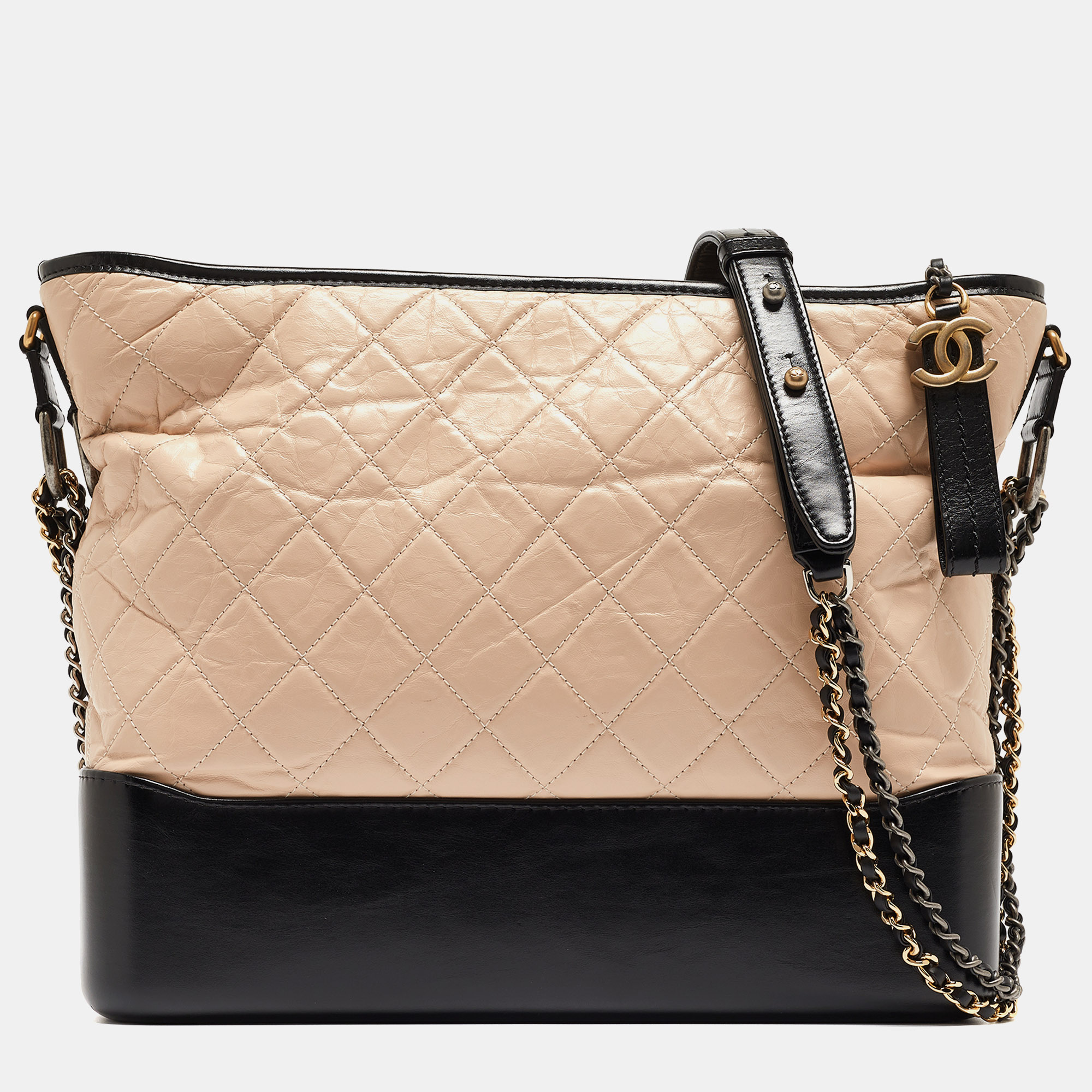 Embrace timeless allure with the Chanel Gabrielle hobo. Crafted with meticulous attention to detail this hobo bag boasts a classic quilted leather design in contrasting hues exuding effortless chic. Its spacious interior and adjustable strap offer both style and practicality for the modern sophisticate.