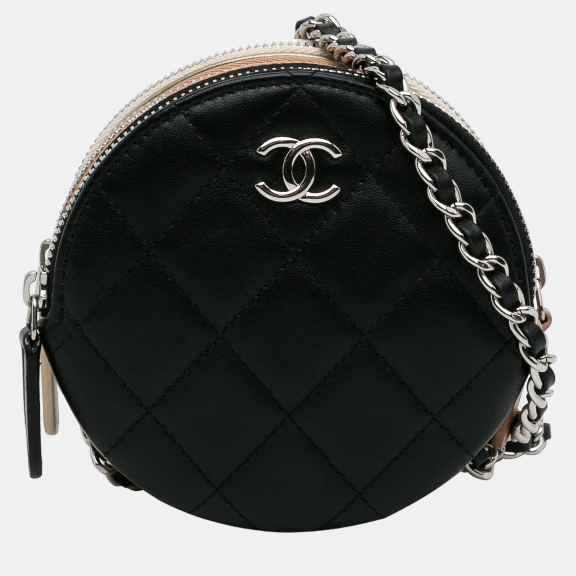 This crossbody bag features a quilted leather body a leather woven chain strap and three top zip closures.