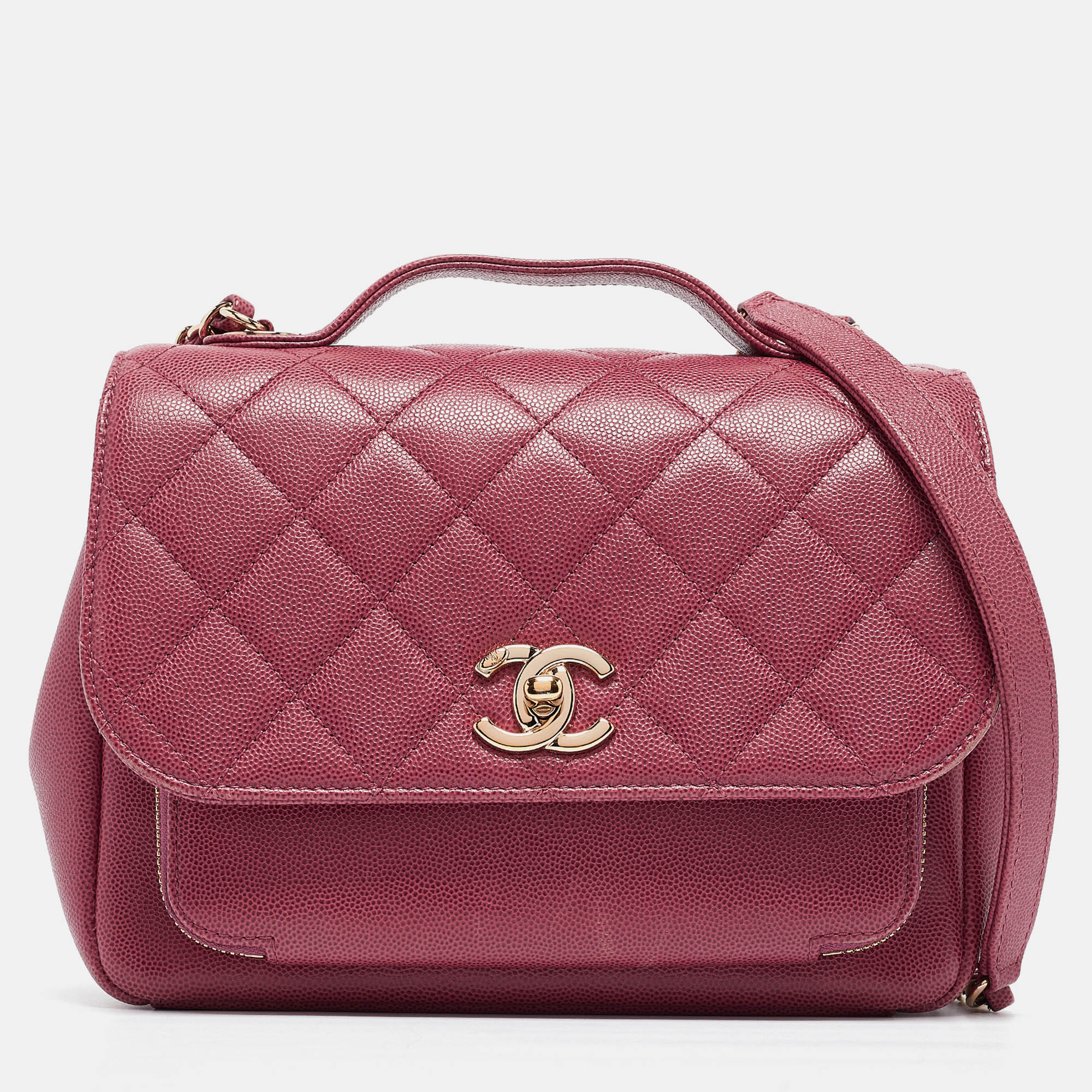 Chanels luxurious Business Affinity Chain Flap bag is a must have in a well curated wardrobe This stunning bag has a masterfully crafted Caviar leather exterior with gold tone hardware and the iconic CC logo on the front. This pink flap bag is complete with a top handle and strap.