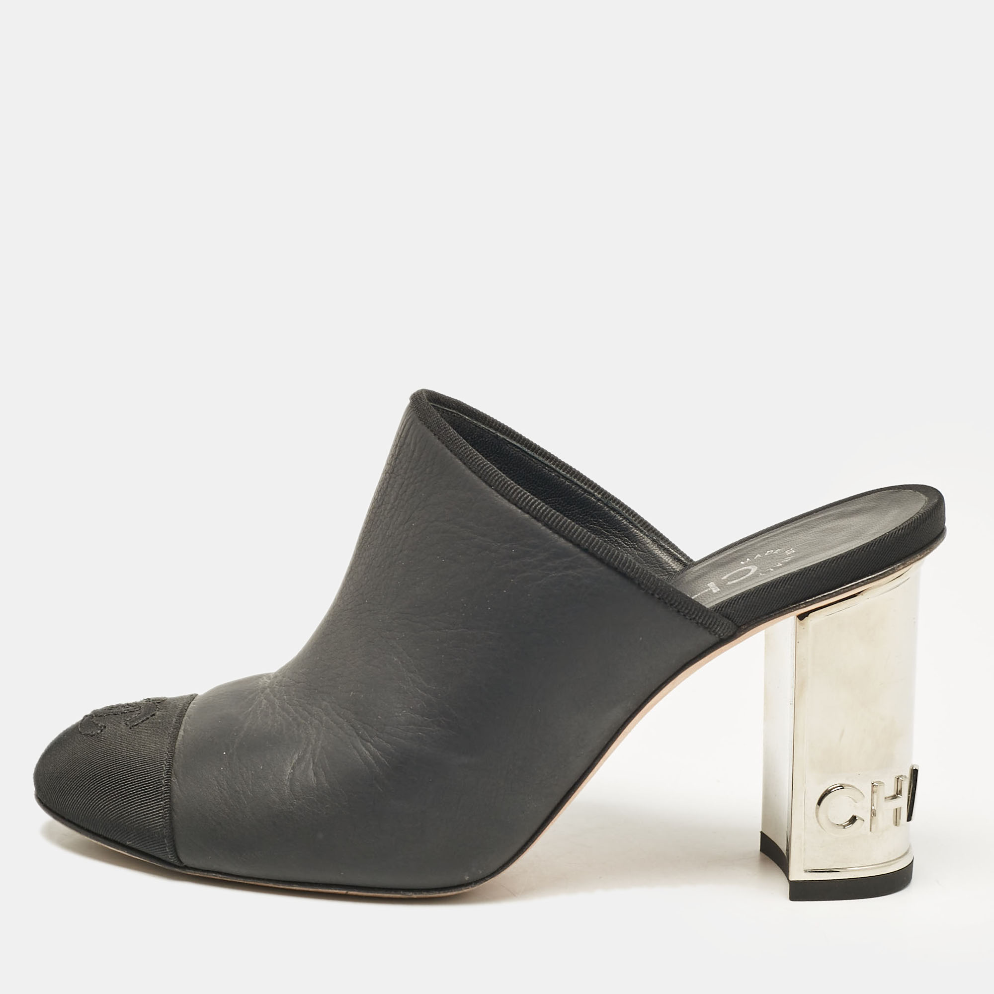 

Chanel Black Leather and Fabric Cap Toe CC Mules Size