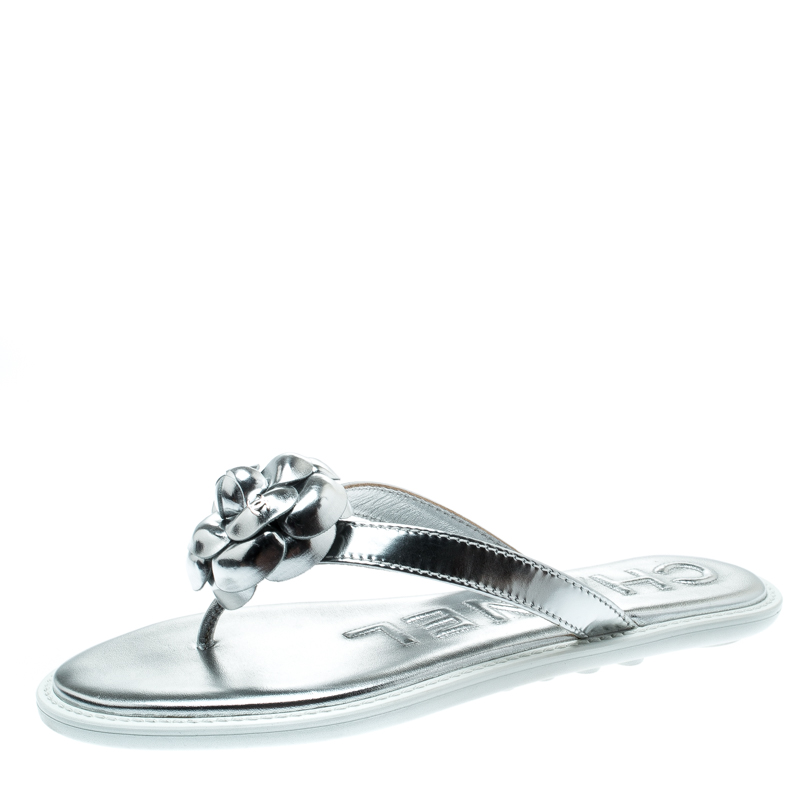 metallic silver flip flops