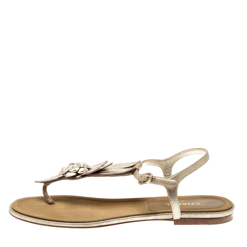 

Chanel Metallic Gold Suede CC Camellia Leaf Pearl Ankle Strap Thong Flat Sandals Size