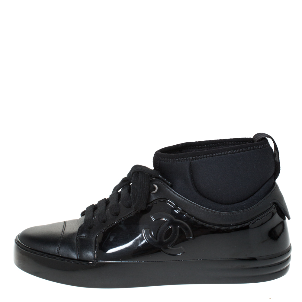 

Chanel Black Leather And Rubber Mid Top Lace Up Sneakers Size