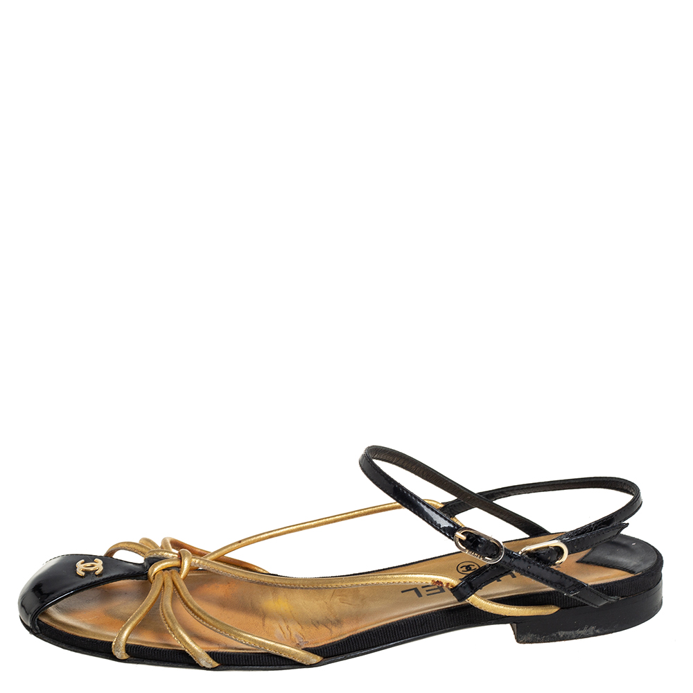 

Chanel Gold/Black Patent And Leather Strappy Flat Sandals Size