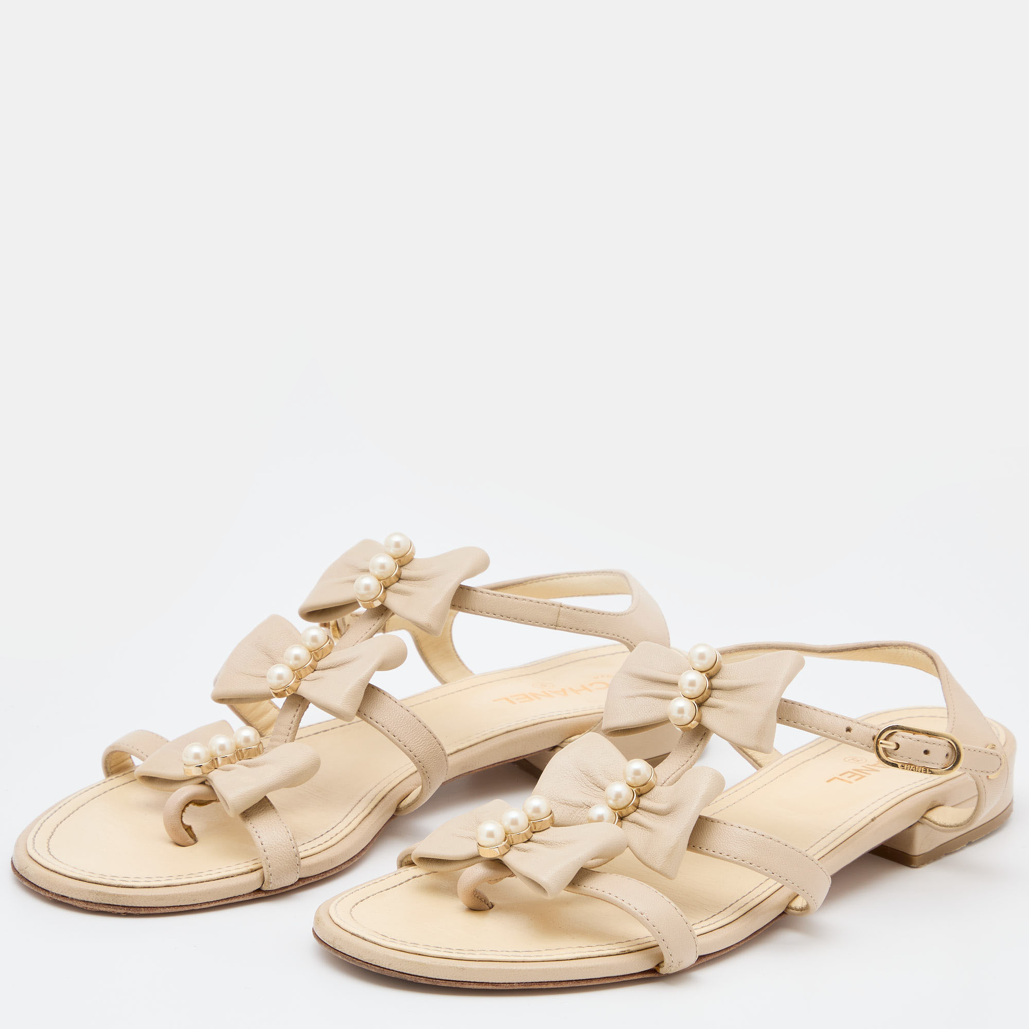 

Chanel Cream Leather Pearl Embellished Bow CC Ankle Strap Flat Sandals Size