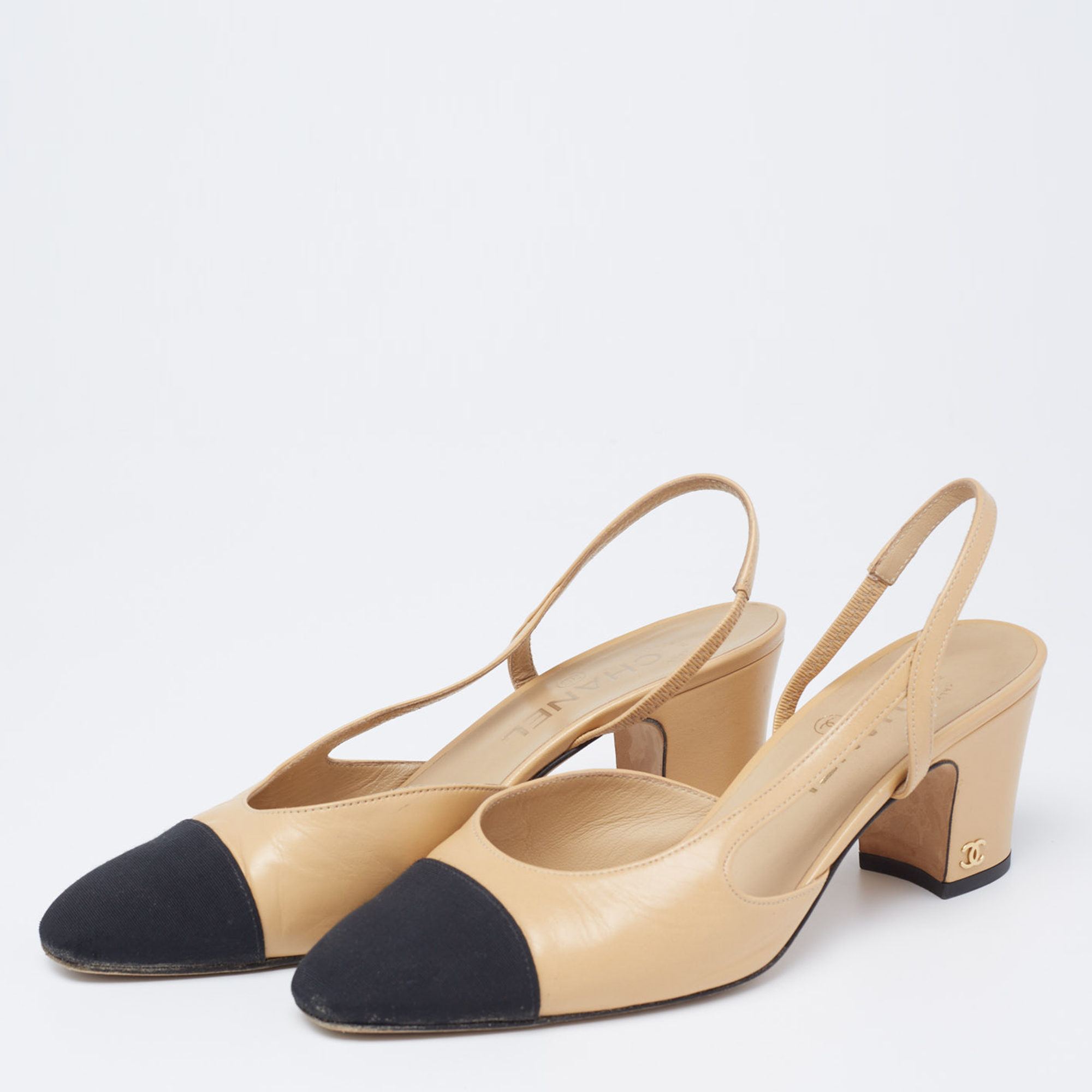 

Chanel Beige/Black Leather And Canvas CC Cap Toe Slingback Pumps Size