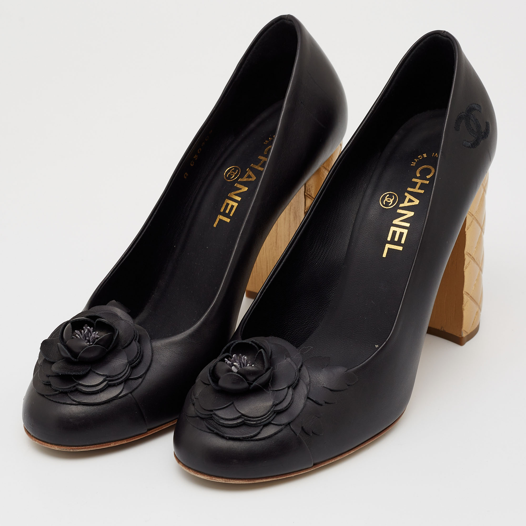 

Chanel Black/Gold Camellia Cap Toe Leather Quilted Heel Pumps Size