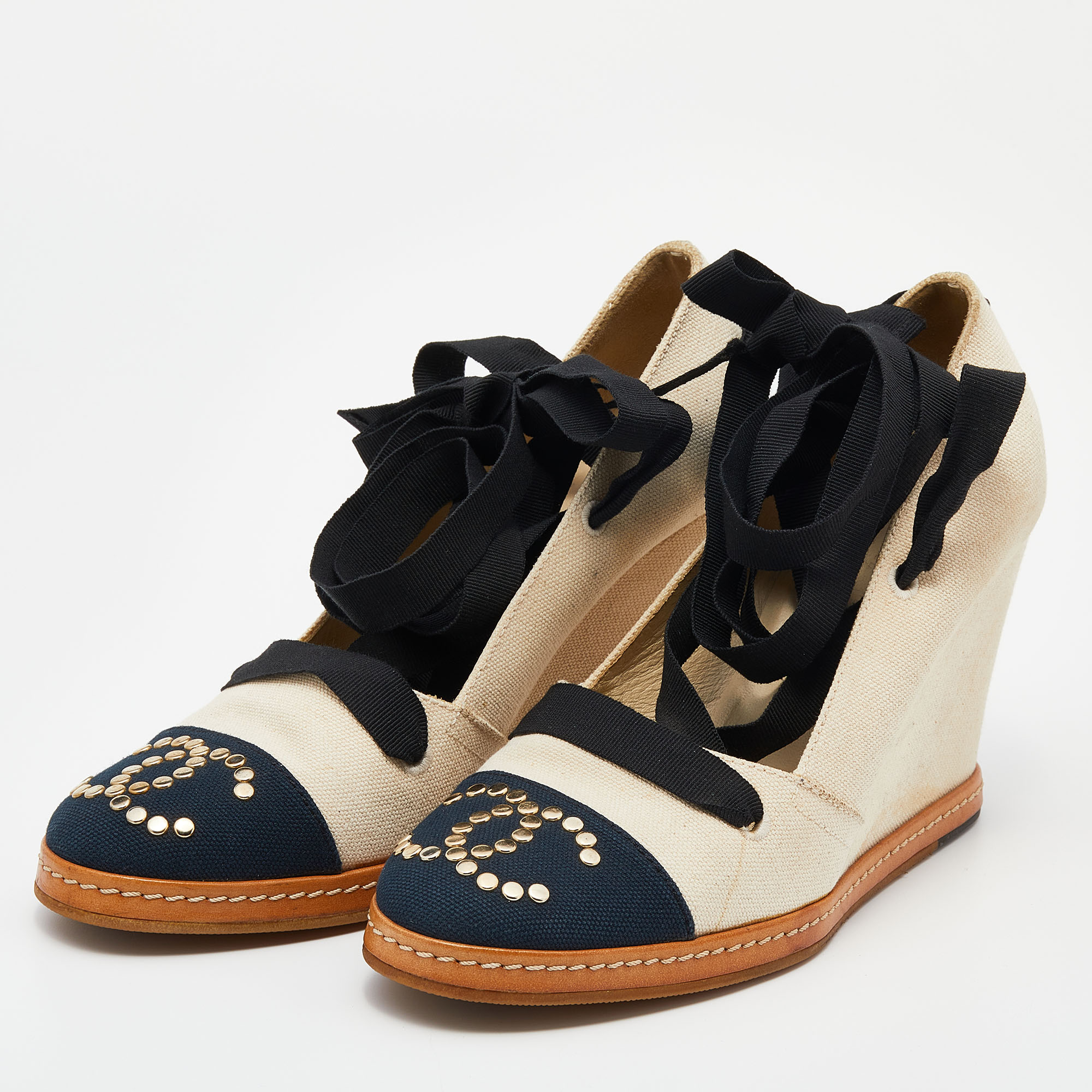 

Chanel Beige/Navy Blue Canvas CC Wedge Pumps Size