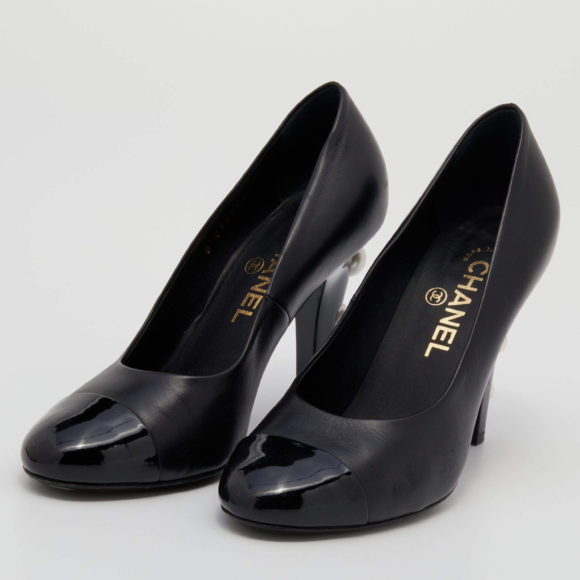 

Chanel Black Leather And Patent Leather Cap Toe CC Pearl Embellished Heels Pumps Size