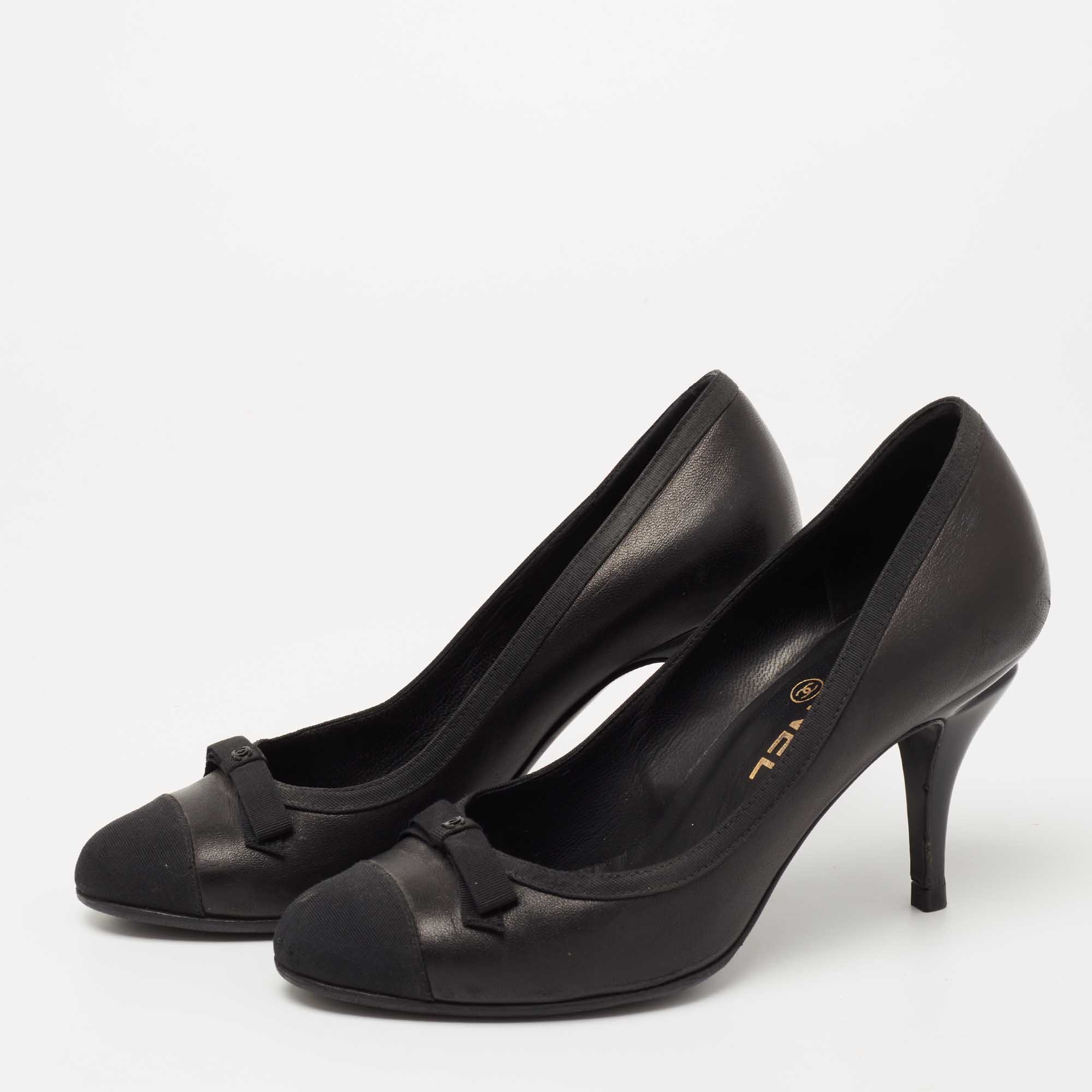 

Chanel Black Canvas And Leather CC Cap Toe Pumps Size