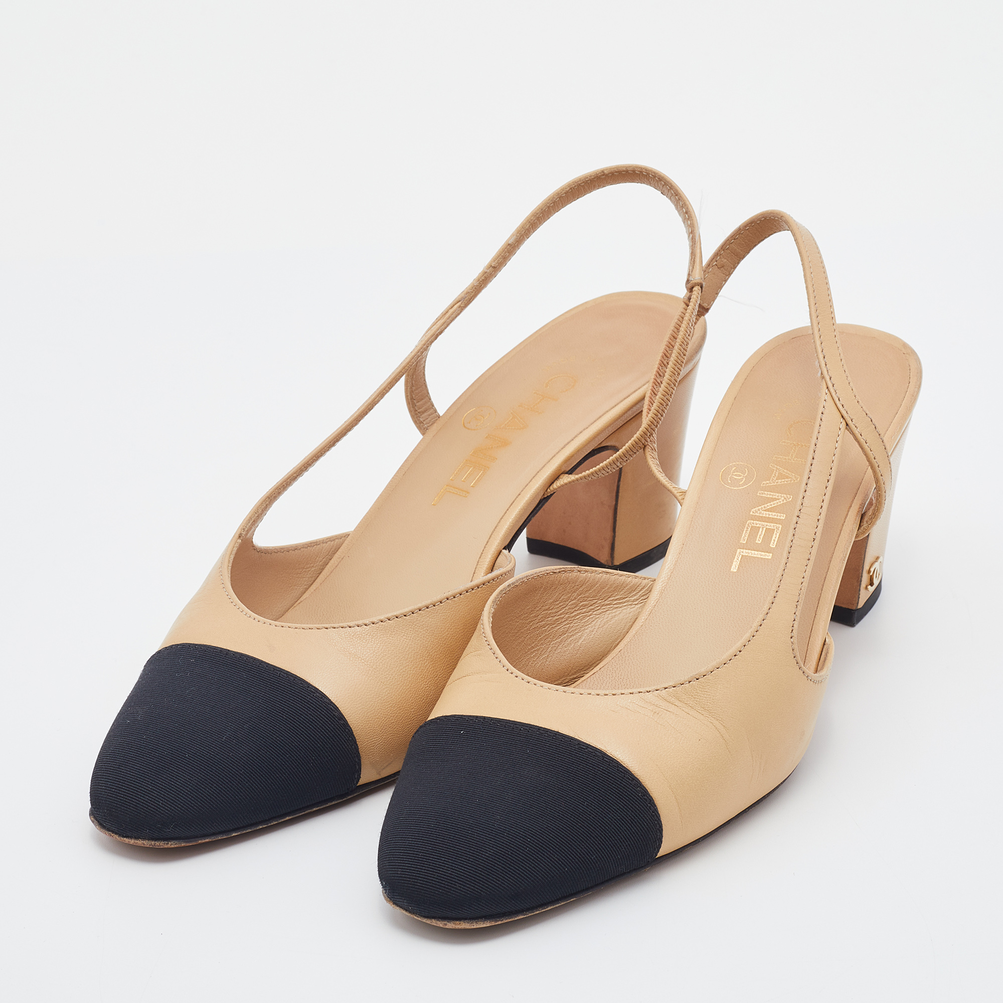 

Chanel Beige/Black Leather And Fabric CC Cap Toe Slingback Sandals Size