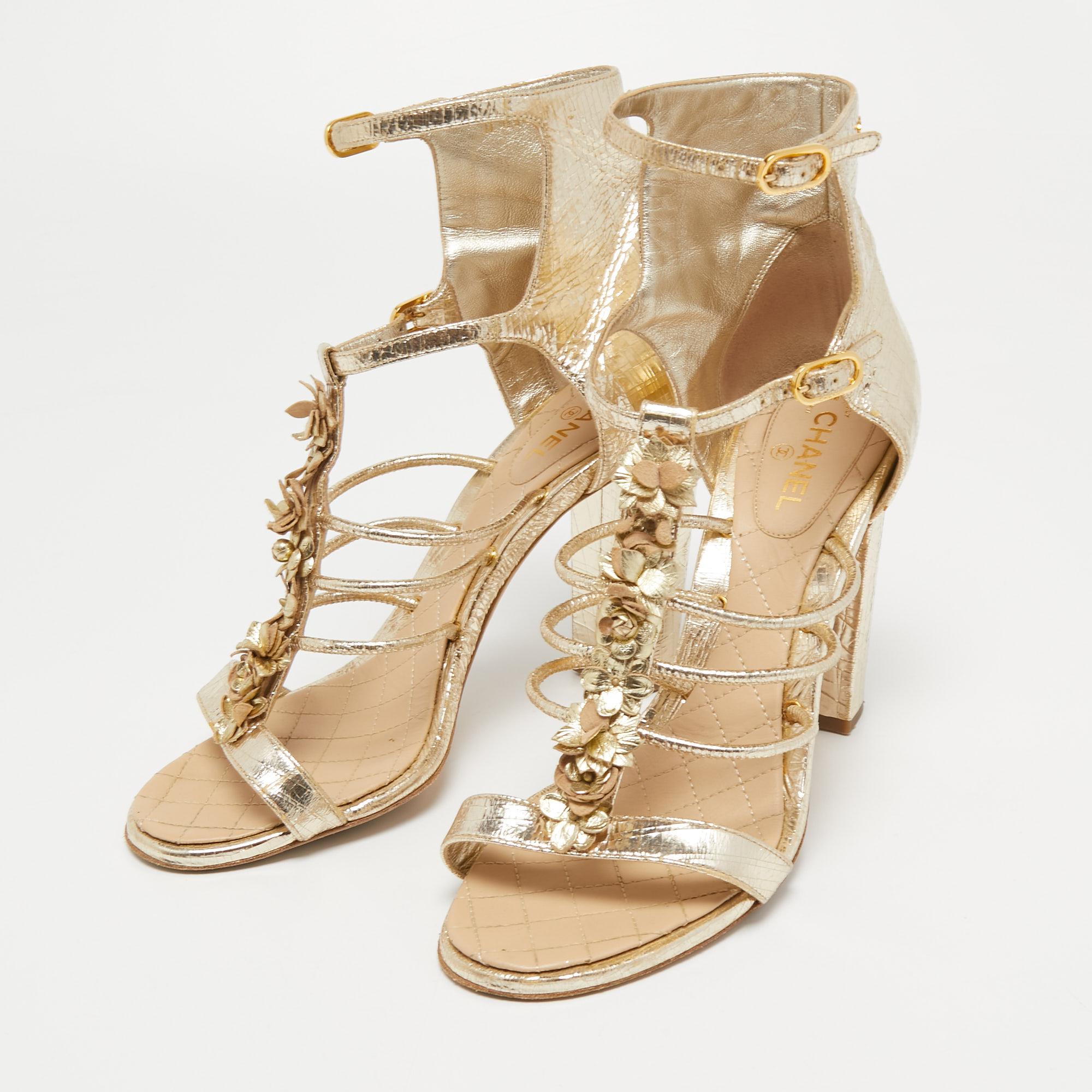 

Chanel Gold Textured Leather Flower Applique Ankle Strap Sandals Size