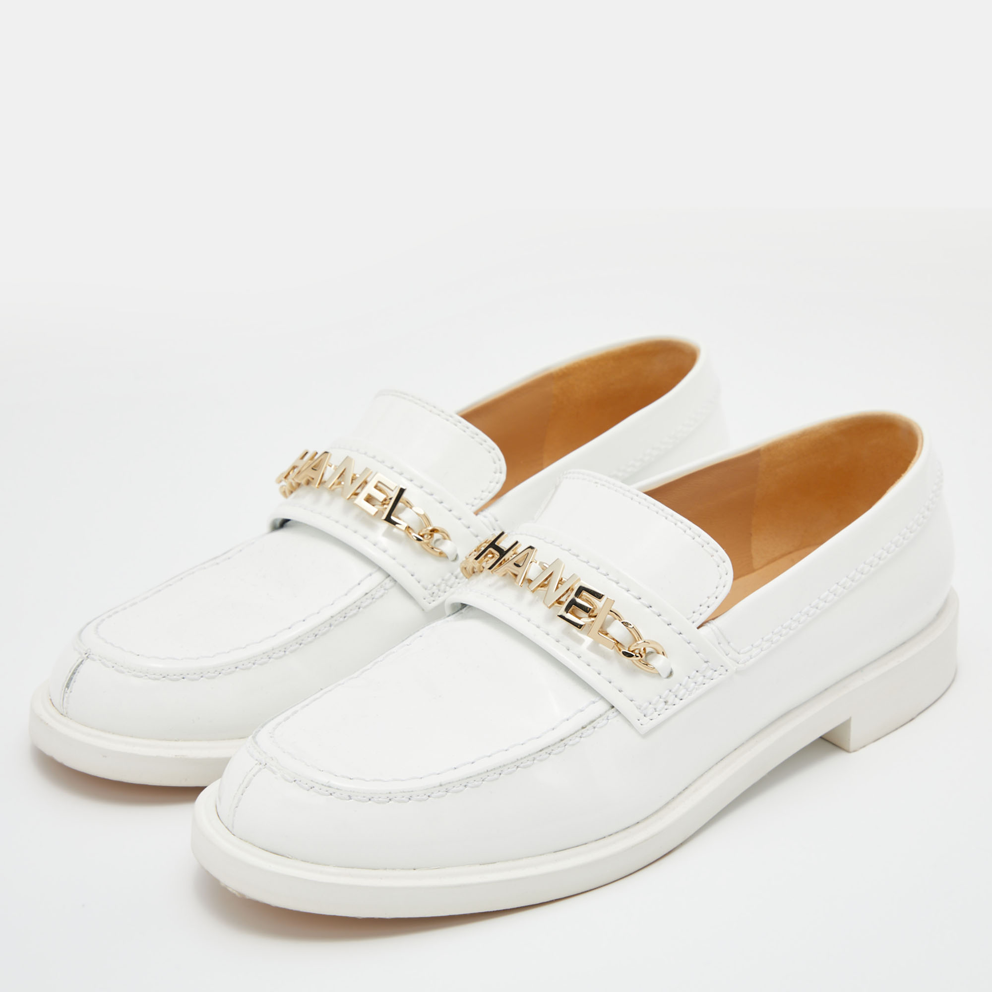 

Chanel White Leather Logo Chain Link Slip On Loafers Size