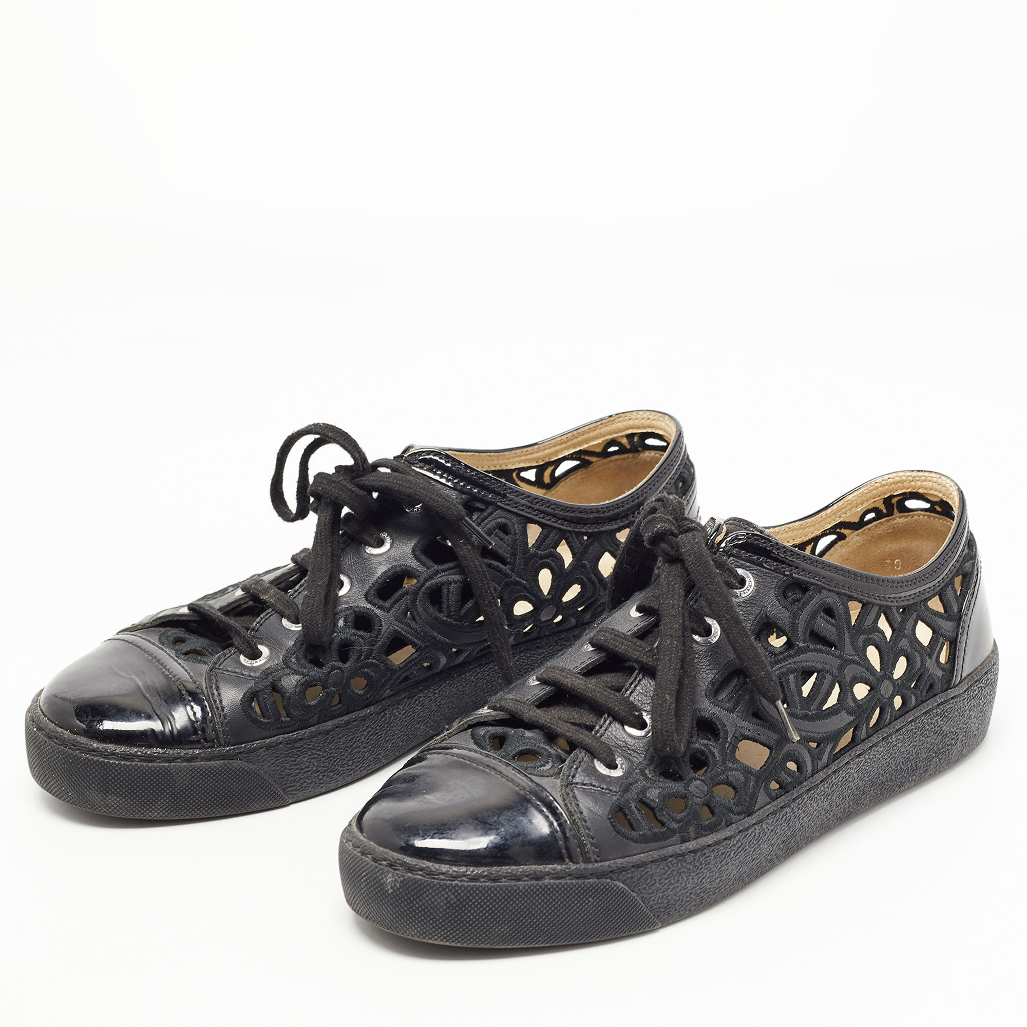 

Chanel Black Patent and Leather Floral Cutout CC Low Top Sneakers Size