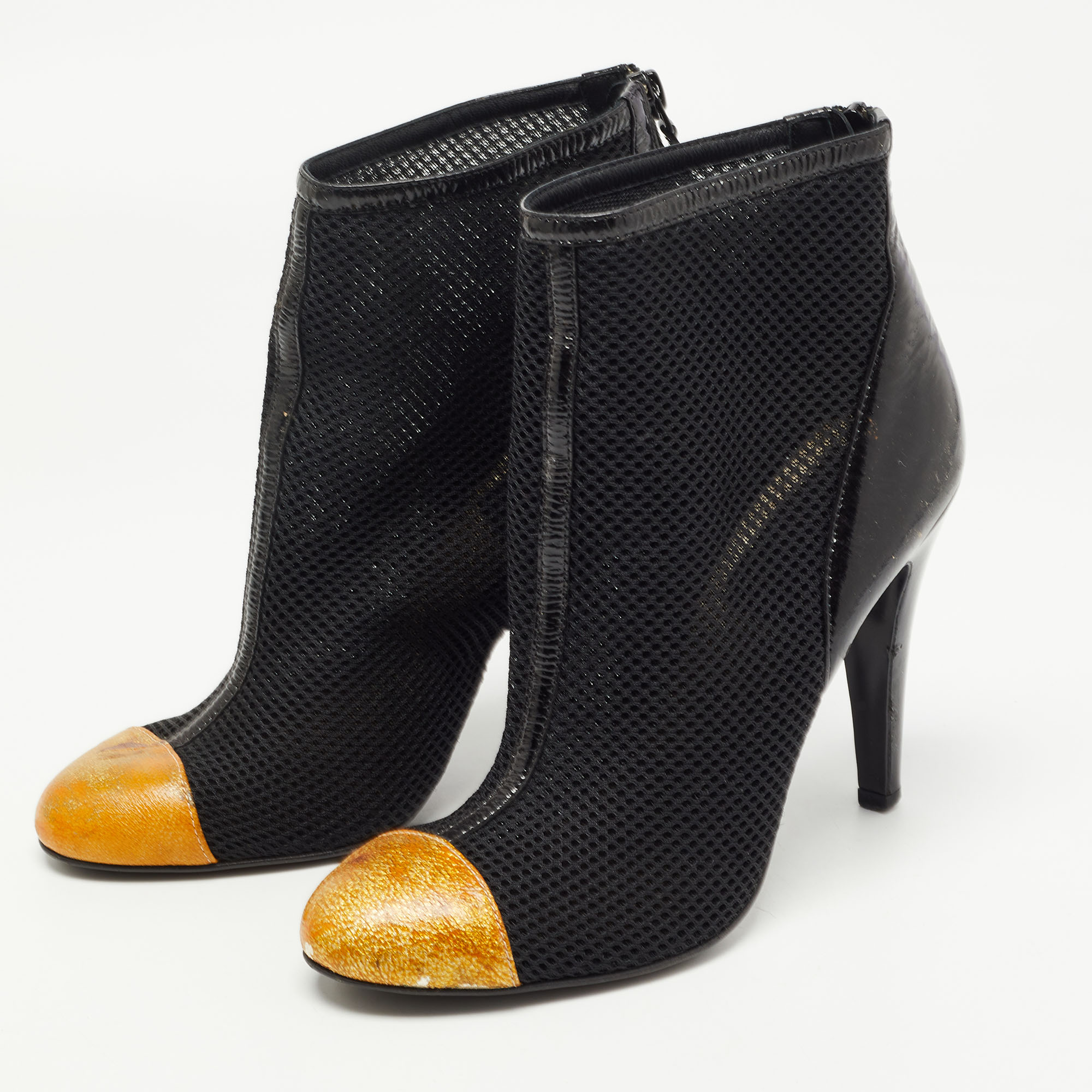 

Chanel Black/Gold Leather and Mesh Cap Toe Ankle Boots Size