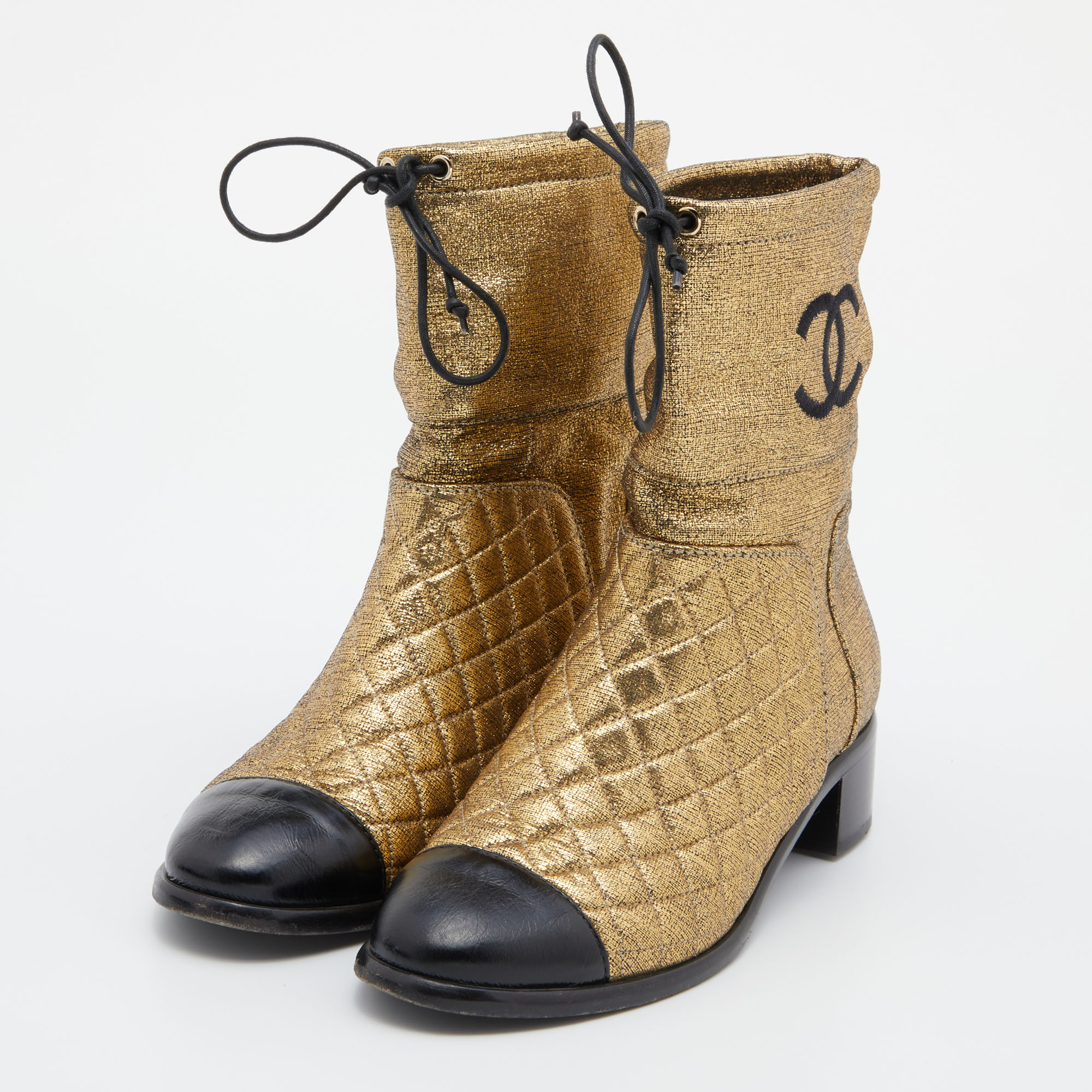 

Chanel Gold Leather Quilted CC Logo Ankle Boots Size