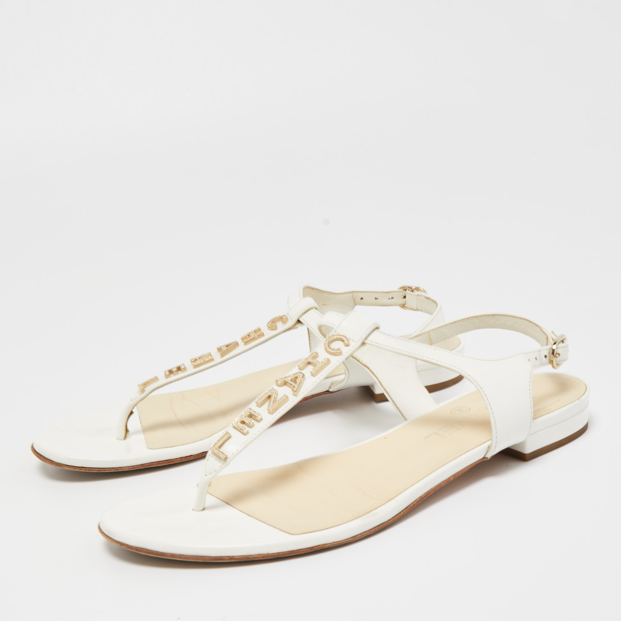 

Chanel White Leather Logo T-Bar Flat Sandals Size