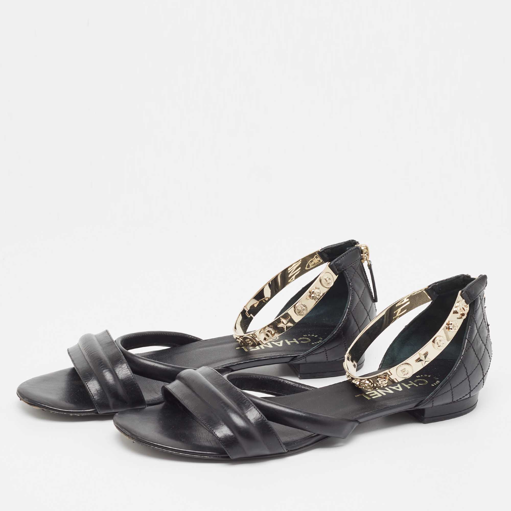 

Chanel Black Leather Charm Embellished Ankle Strap Flat Sandals Size