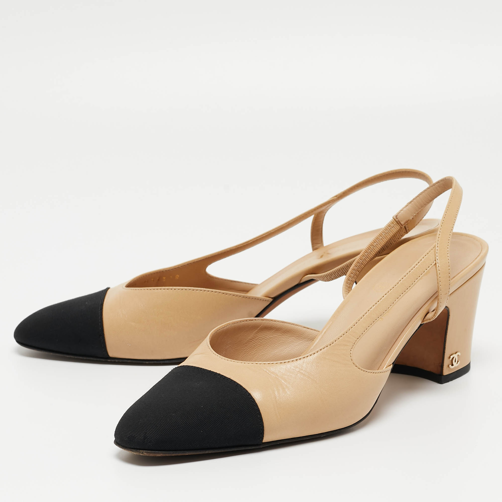 

Chanel Beige/Black Leather and Canvas CC Slingback Pumps Size