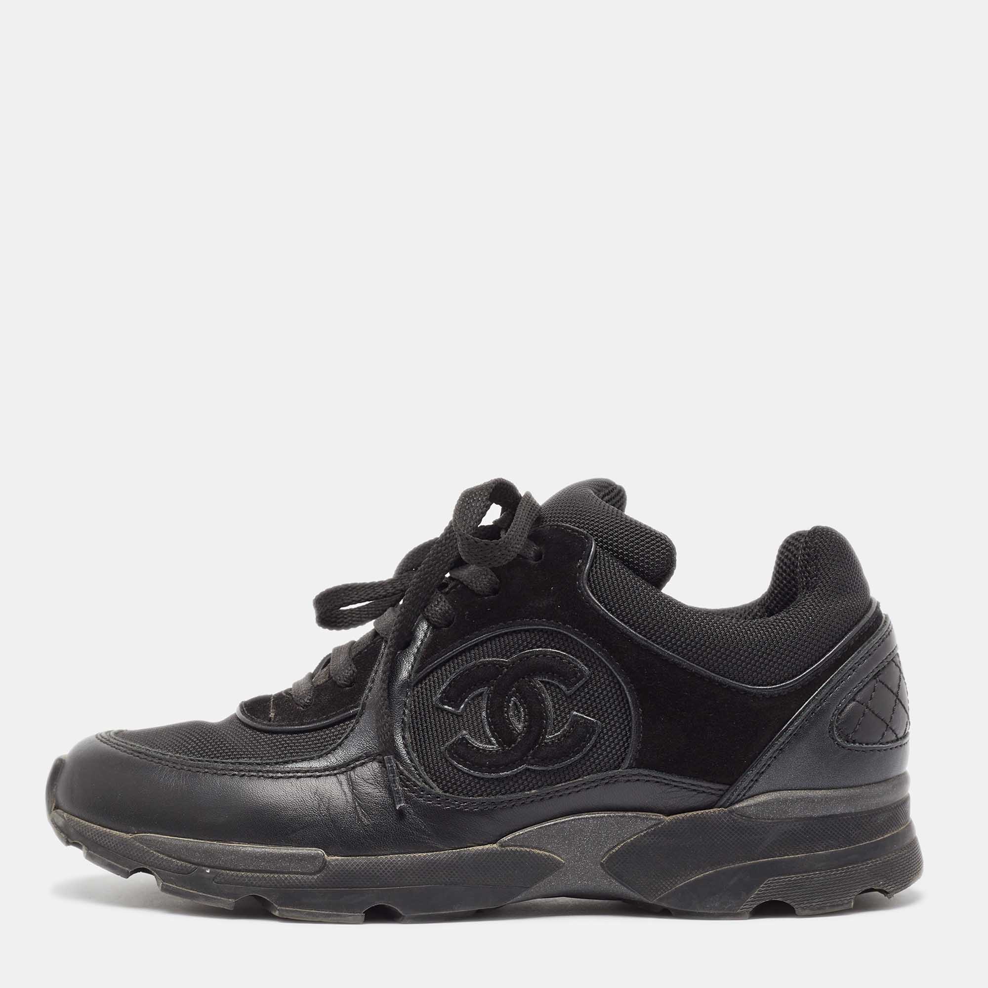 Coming in a classic silhouette these Chanel black sneakers are a seamless combination of luxury comfort and style. These sneakers are finished with signature details and comfortable insoles.