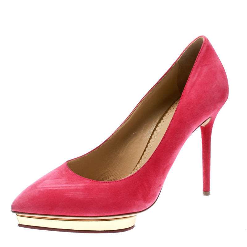 Bring home these Charlotte Olympia pumps today and get set to enjoy dazzling day outs Crafted out of suede in a heart skipping pink shade and lined with leather on the insoles this number is from their Dotty collection. Theyve been beautified with stiletto heels and gold toned platforms.