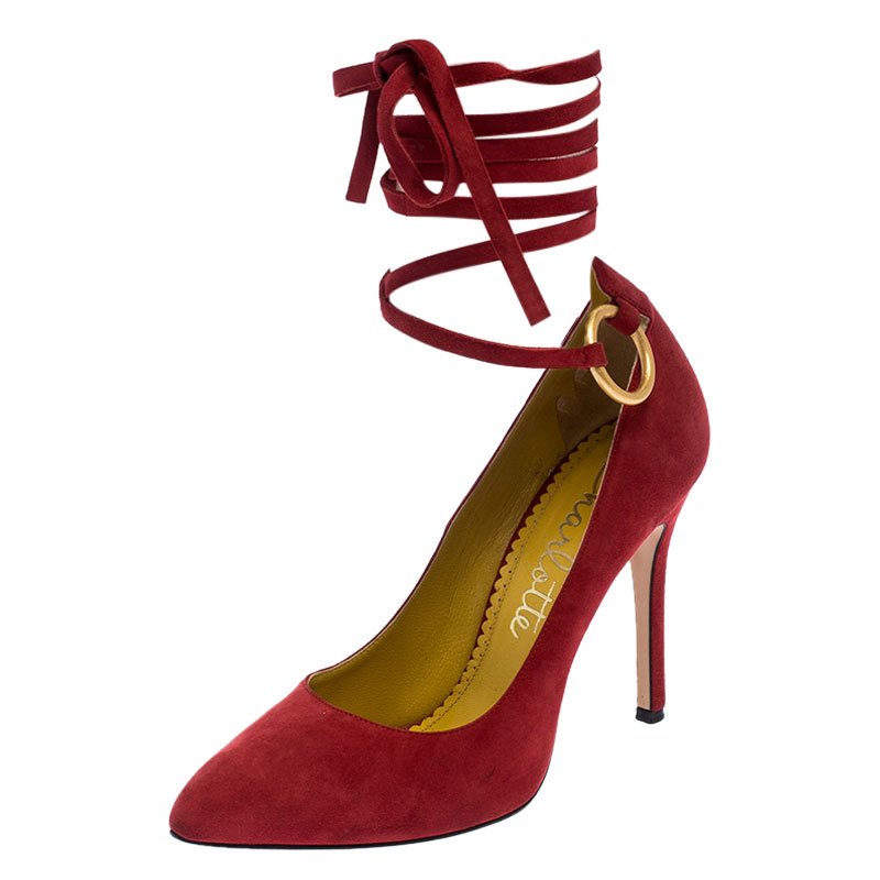 Flaunt these fabulous pumps from Charlotte Olympia in style. These suede pumps are ideal for those days when you want to make an effortless fashion statement. These red pumps feature pointed toes ankle wrap fastening and 10 cm heels.