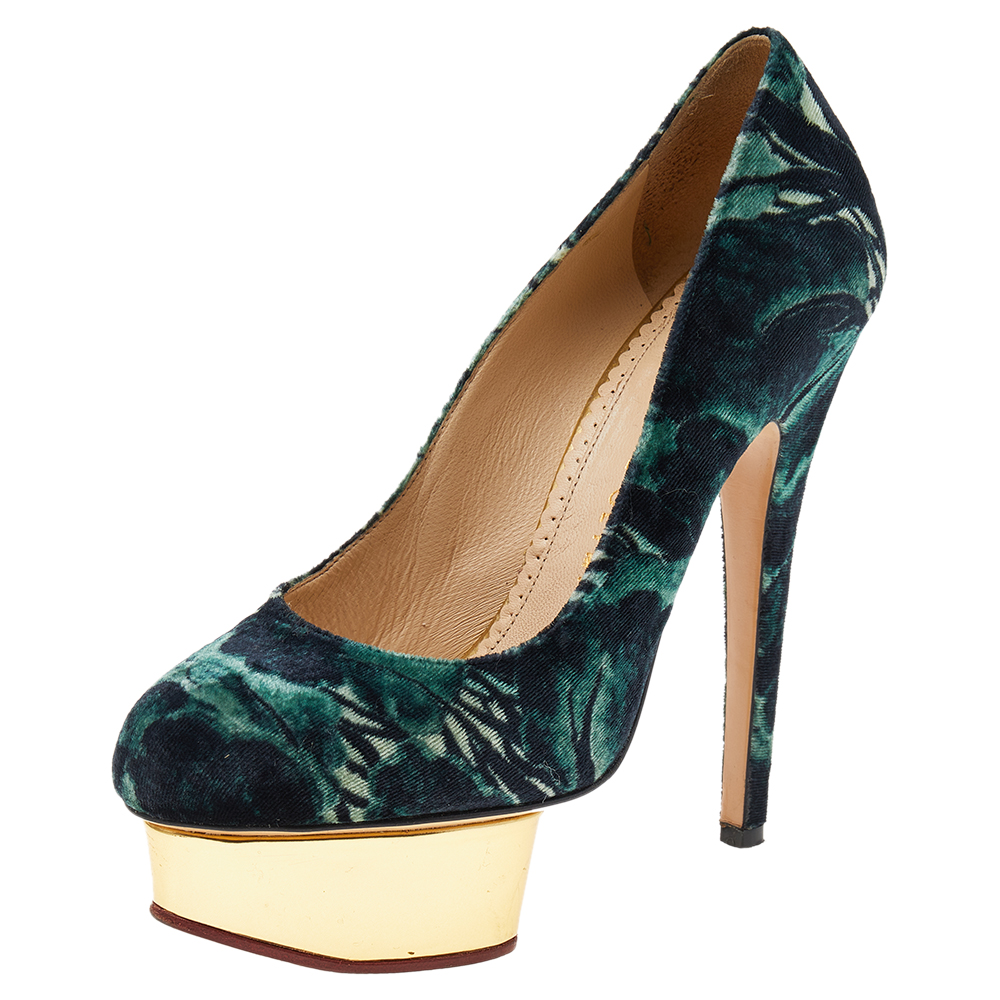 These meticulously crafted Dolly pumps from Charlotte Olympia are definitely something you should own as a fashionista. Made out of printed velvet in a classy shade of green these pumps rest on an elevated platform and high stiletto heels to give your look that perfect touch of glamour to make it complete.