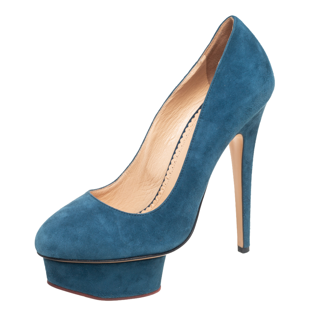 Own this meticulously designed pair of Charlotte Olympia pumps today and dazzle everyone whenever you step out Crafted out of suede and lined with leather on the insoles this creation is from their Dolly collection. They have been beautified with 14.5 cm heels and platforms.