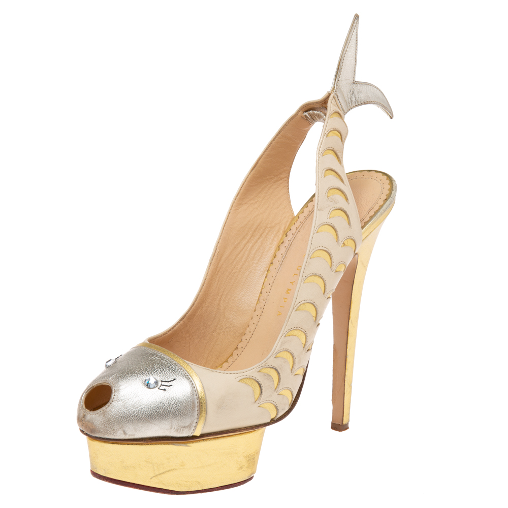 Charlotte Olympia presents to you these stunning slingback pumps for special occasions. Crafted with gold hued leather they flaunt an eye catching and unique fish design swimming from the vamps to the counters. These Catch of the Day pumps come with matching gold tone hardware and are absolute head turning creations