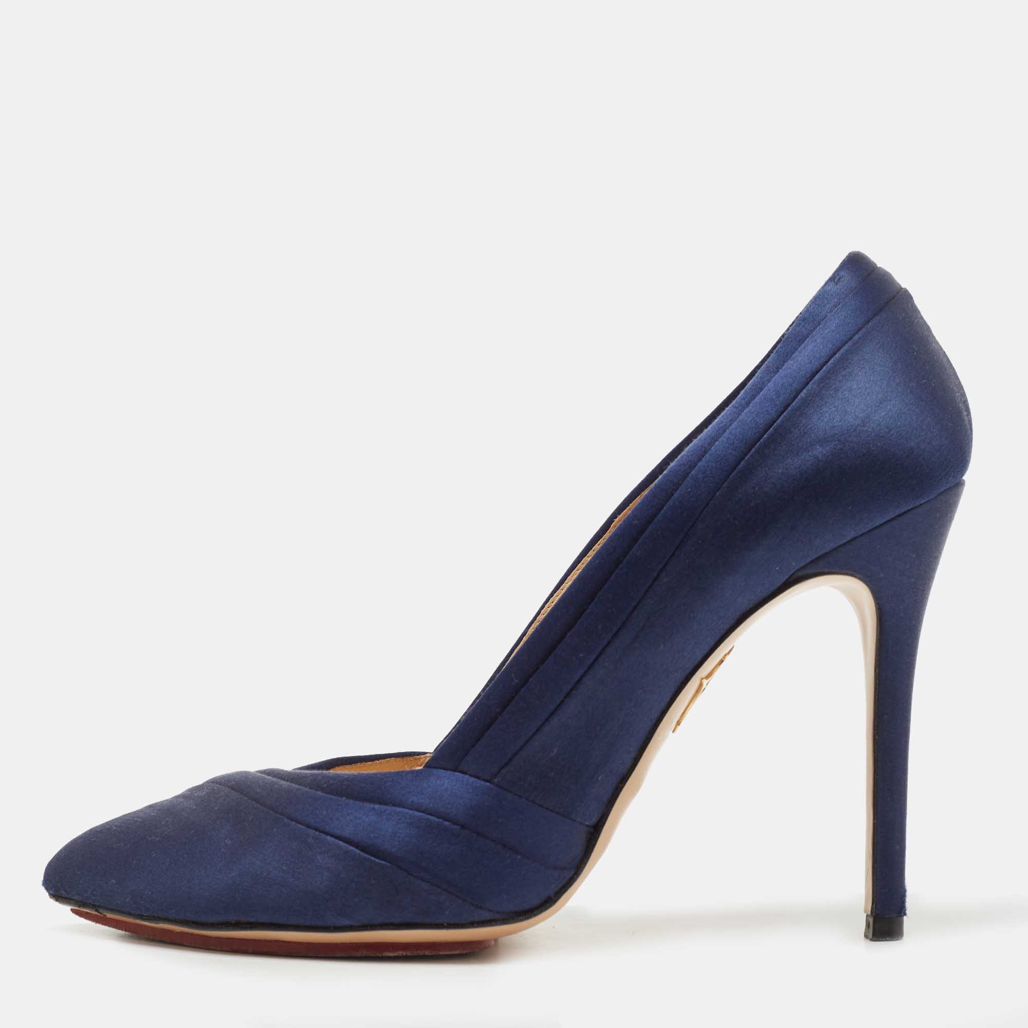 Beautiful and fabulous this pair of Charlotte Olympia pumps will take you to new levels. Made from satin their smooth exterior has just the right amount of shine colored with a navy blue shade. The platforms and 12cm heels finish them off perfectly.
