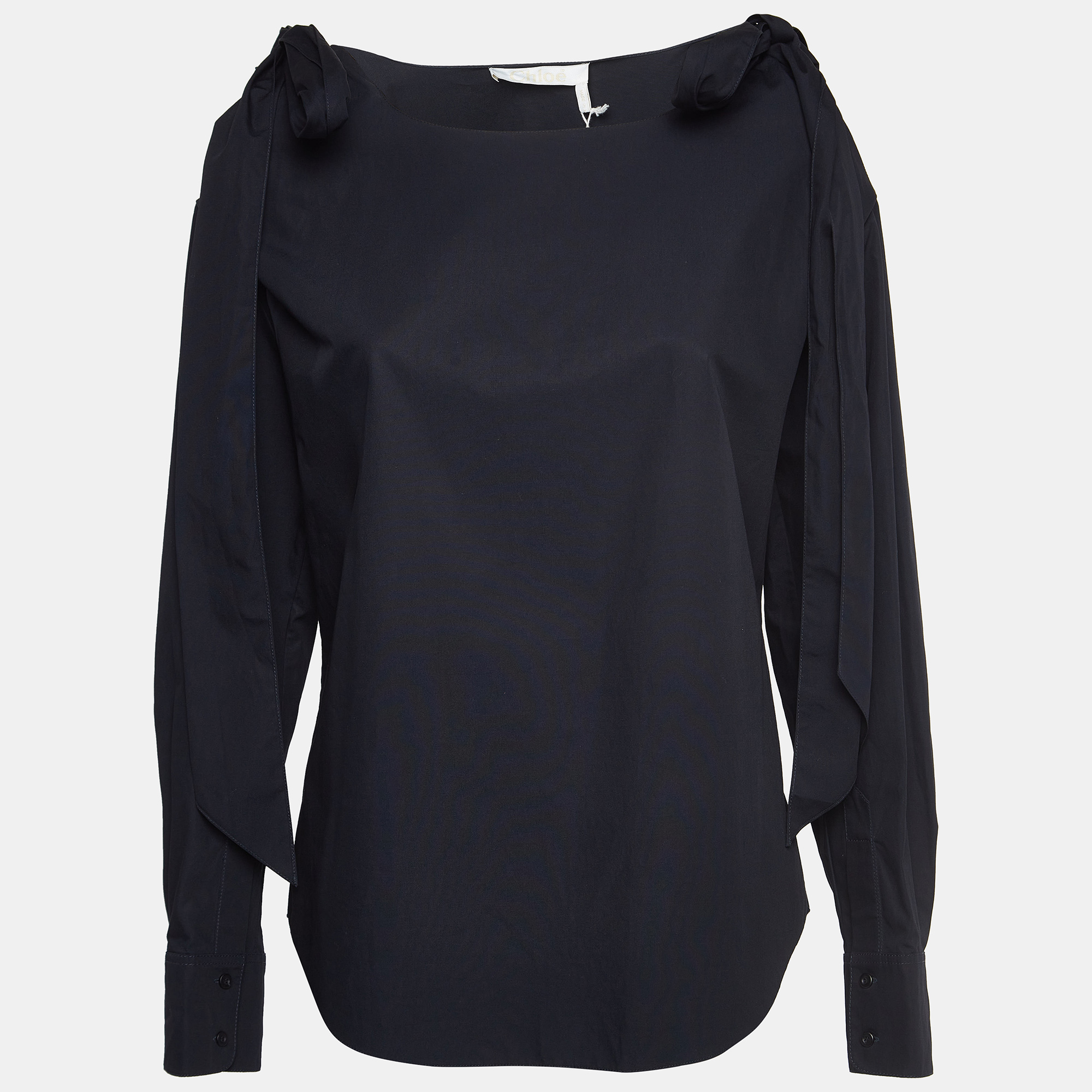 Indulge in elegance with this Chloe blouse. The use of cotton and the addition of cold shoulder cuts create a timeless piece that redefines sophistication and elevates your fashion quotient.