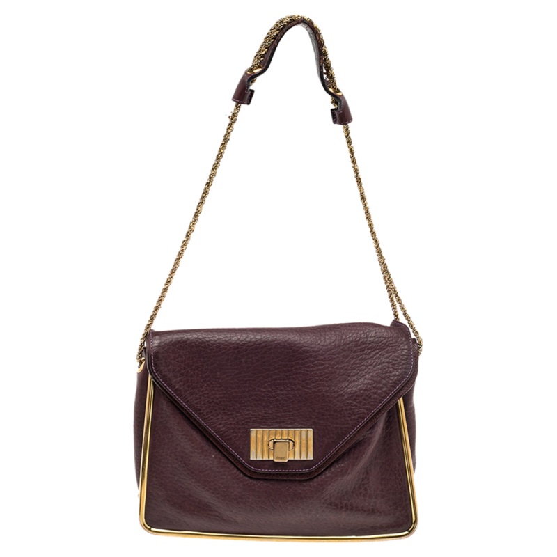 This stylish Sally shoulder bag from Chloe is crafted from pebbled leather and gold tone metal. The bag features a chain link handle with a leather rest and a flip lock on the flap. This Sally is added with a spacious lined interior.