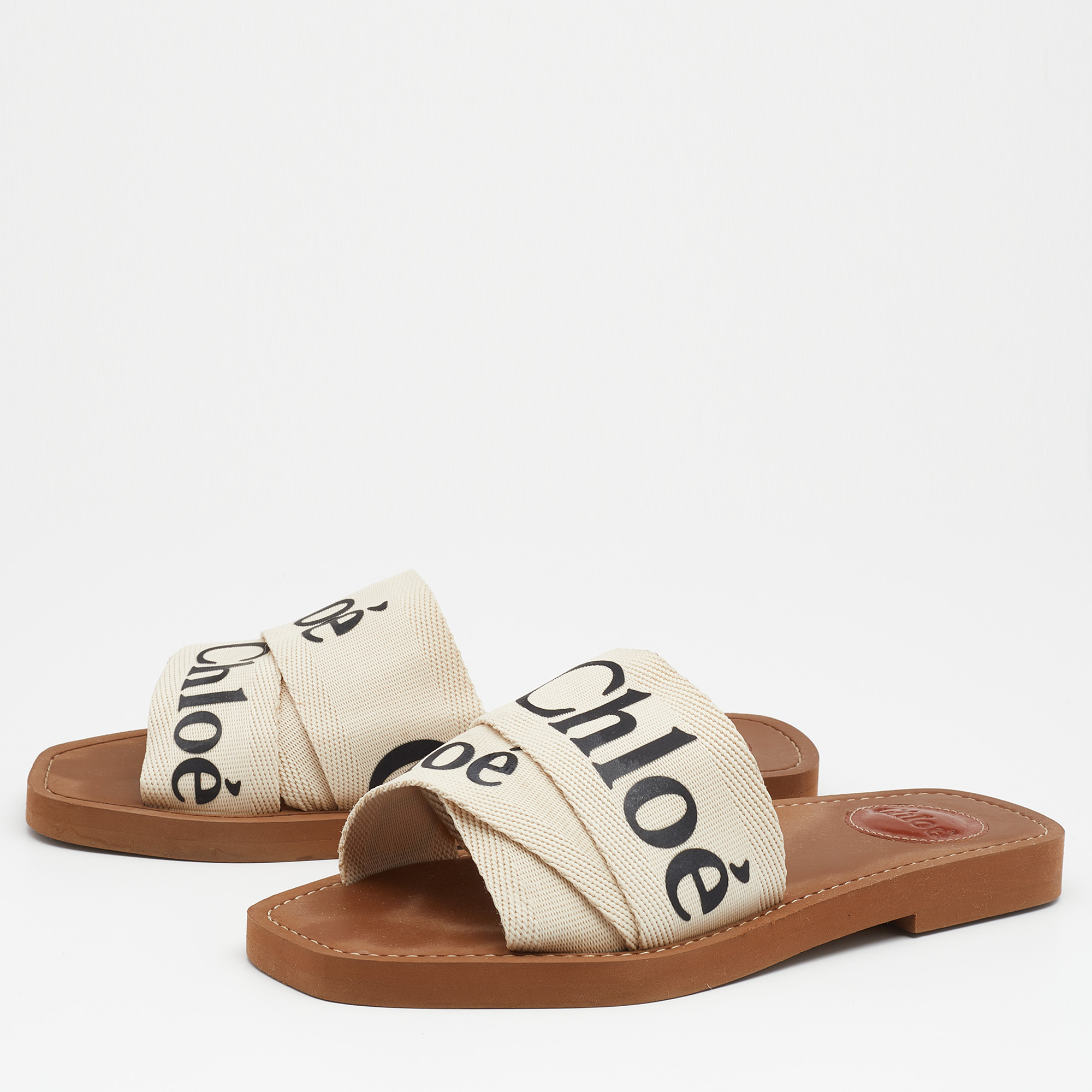 

Chloé Off White Canvas Logo Ribbon Woody Flat Sandals Size