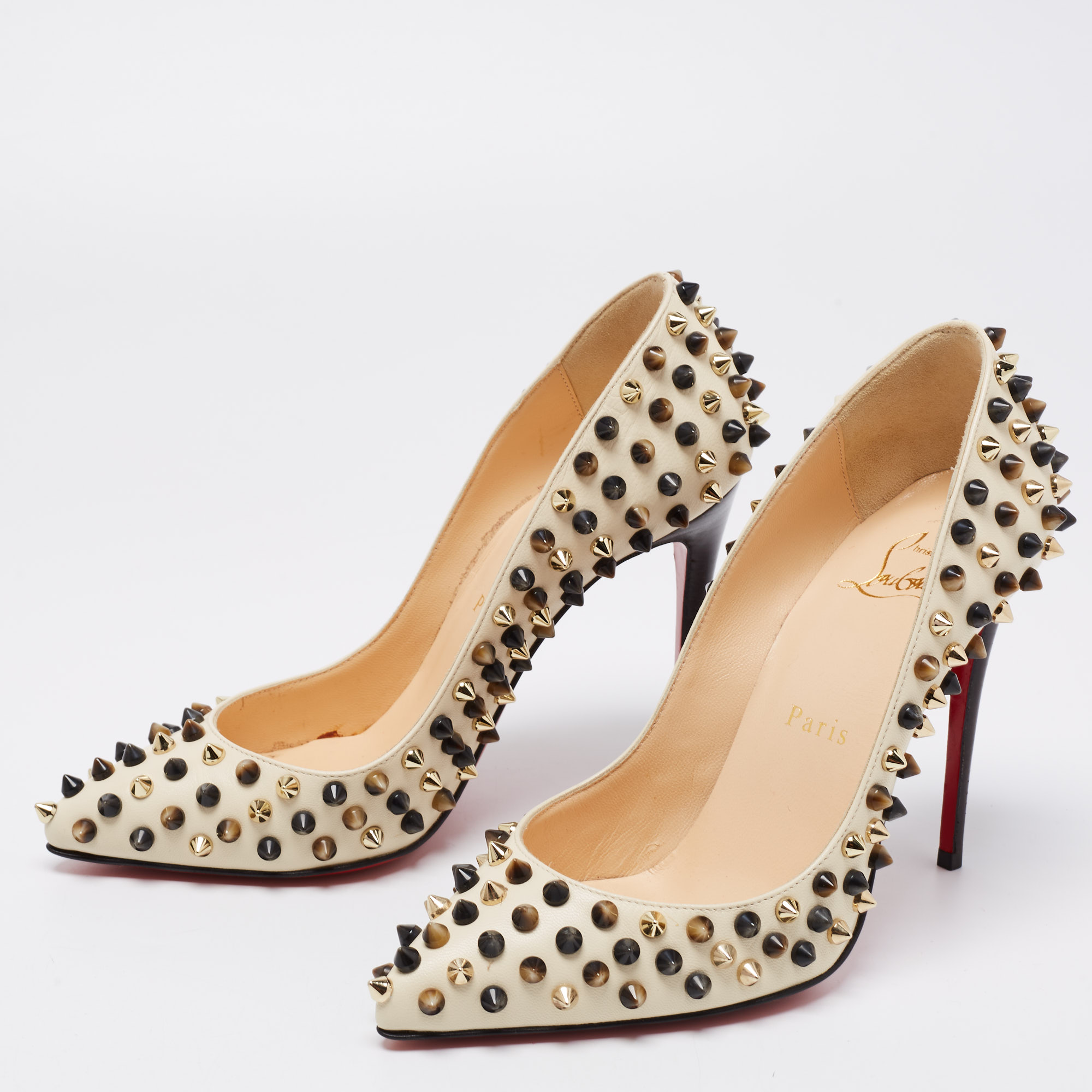 

Christian Louboutin Cream Leather Follies Spikes Pumps Size