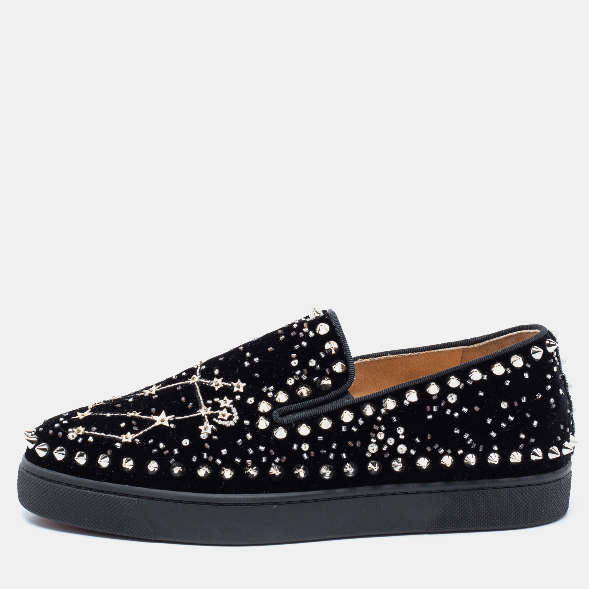 Beautifully crafted using black velvet these Christian Louboutin slip on sneakers are sure to keep you comfortably stylish. Featuring spikes and other embellishments on the uppers and flexible rubber soles in the iconic red these shoes will be a great addition to your closet.
