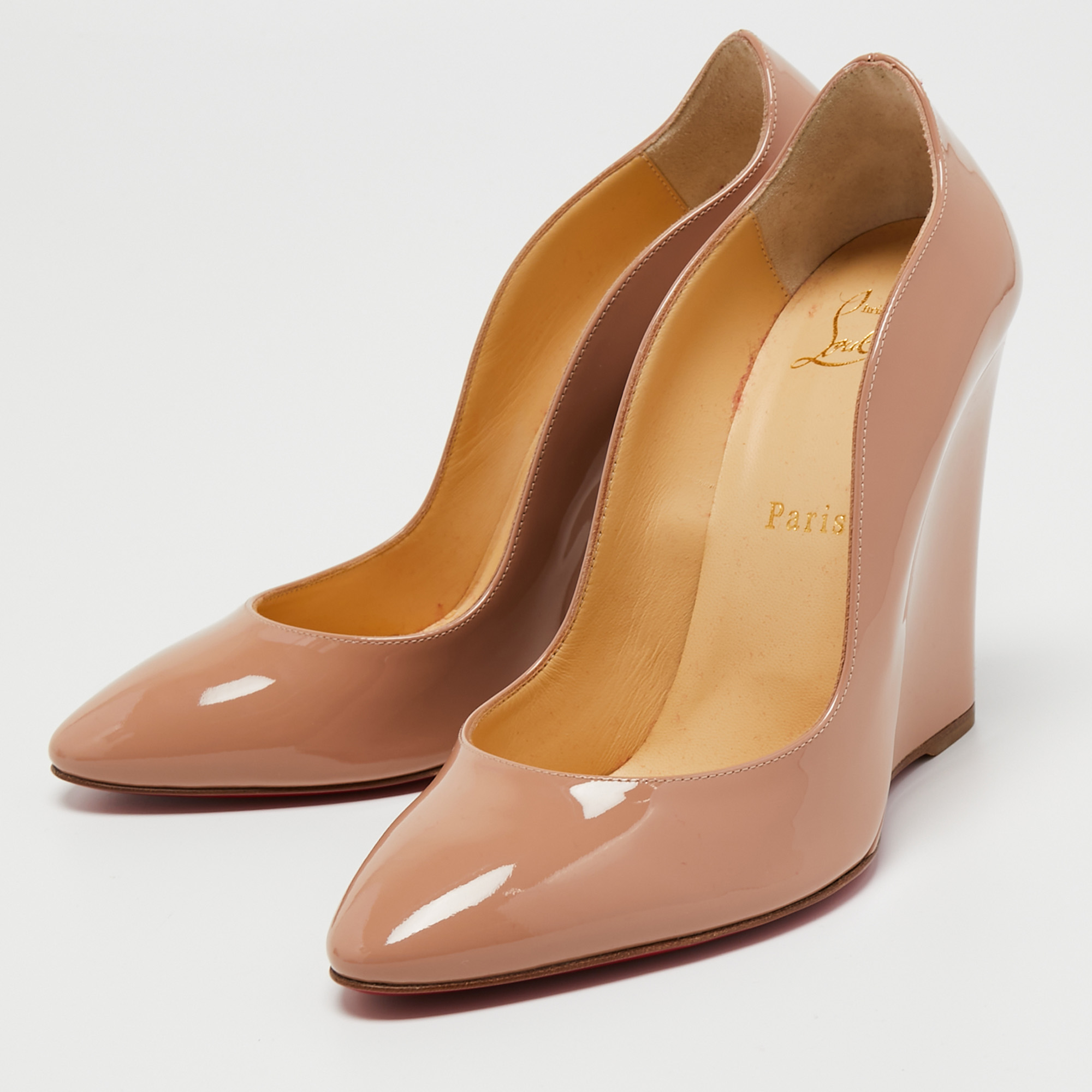 

Christian Louboutin Beige Patent Leather Wedge Pumps Size