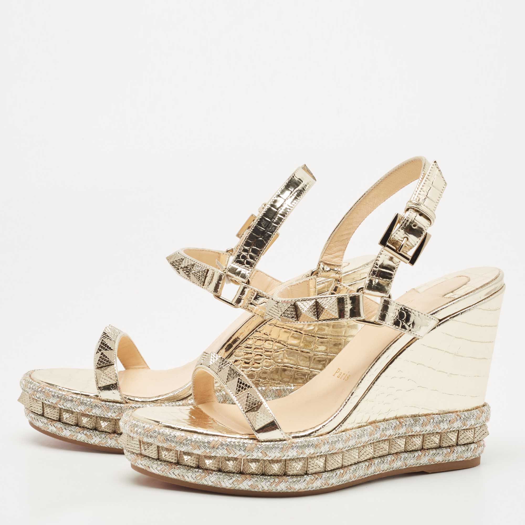 

Christian Louboutin Gold Leather Pyraclou Wedge Sandals Size