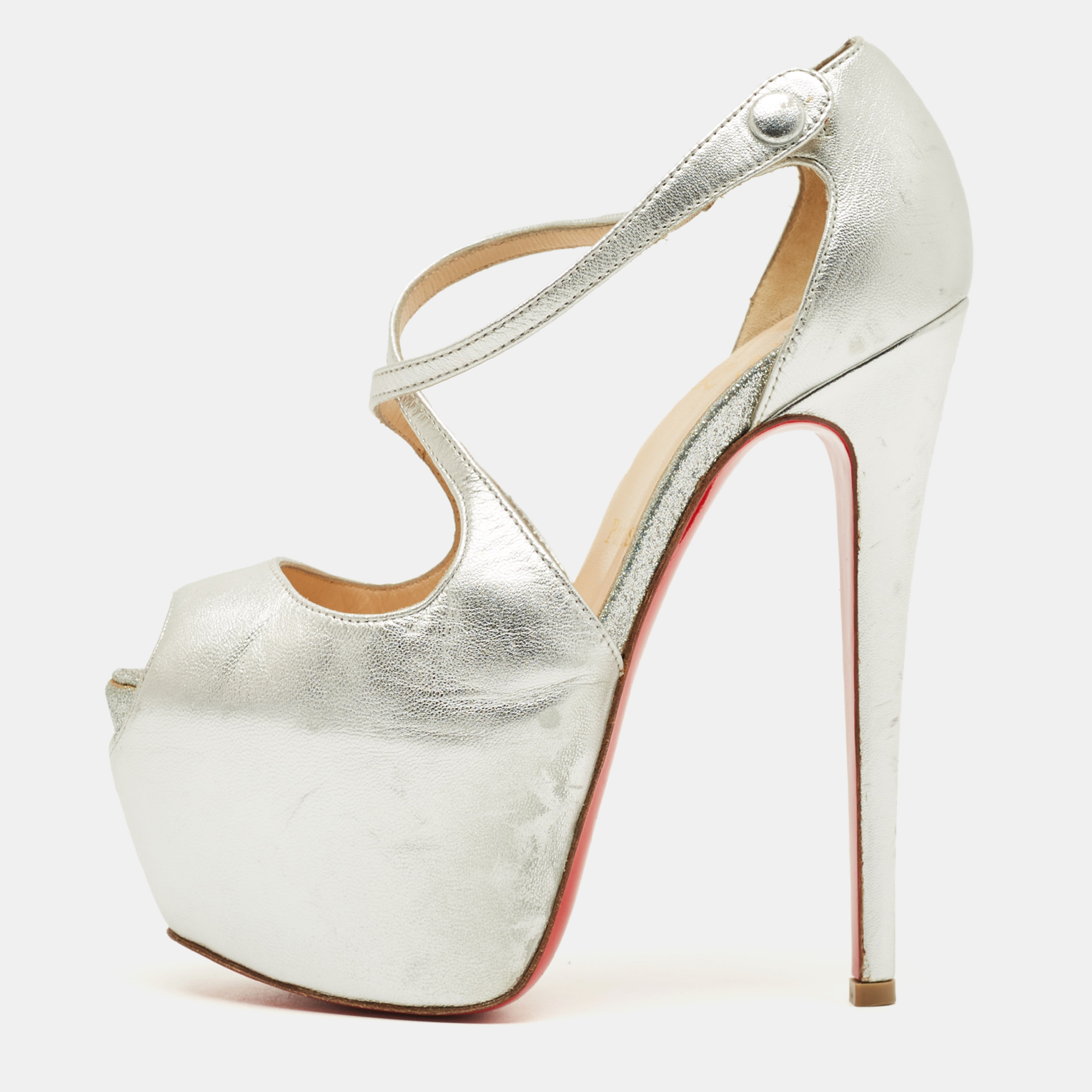 Click to view more detailed imagery on our partner's website Pre-owned Christian Louboutin Cross Me Size 35 Silver Leather Ankle Strap Sandals