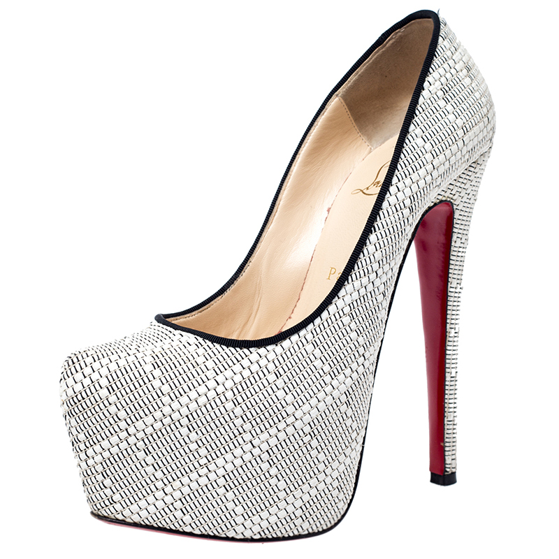 Take your love for Louboutins to new heights by adding this gorgeous pair to your collection. The pumps simply speak high fashion in every stitch and curve. The exteriors come made from white raffia and the pumps are finished with platforms 15.5 CM heels and the famous red soles.